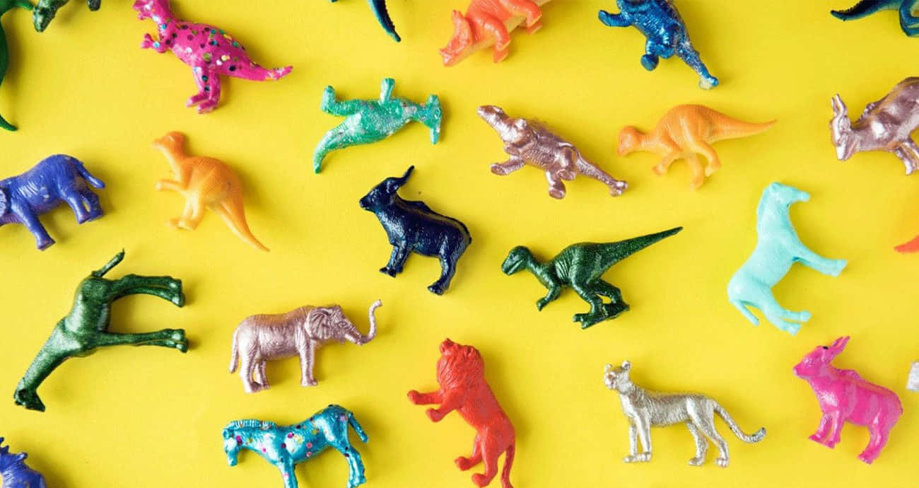 inclusive zoo animal toys, metallic animal figurines, bright yellow background, HD Desktop Wallpaper