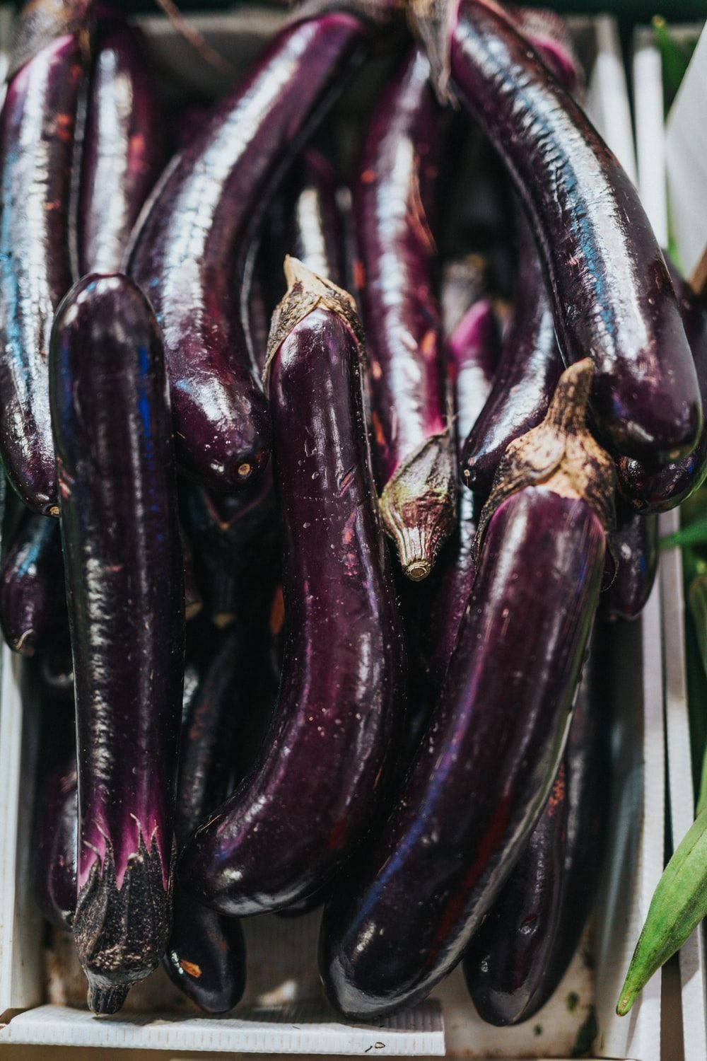 long purple eggplant fruits, glossy purple eggplants, white crate, HD Phone Wallpaper