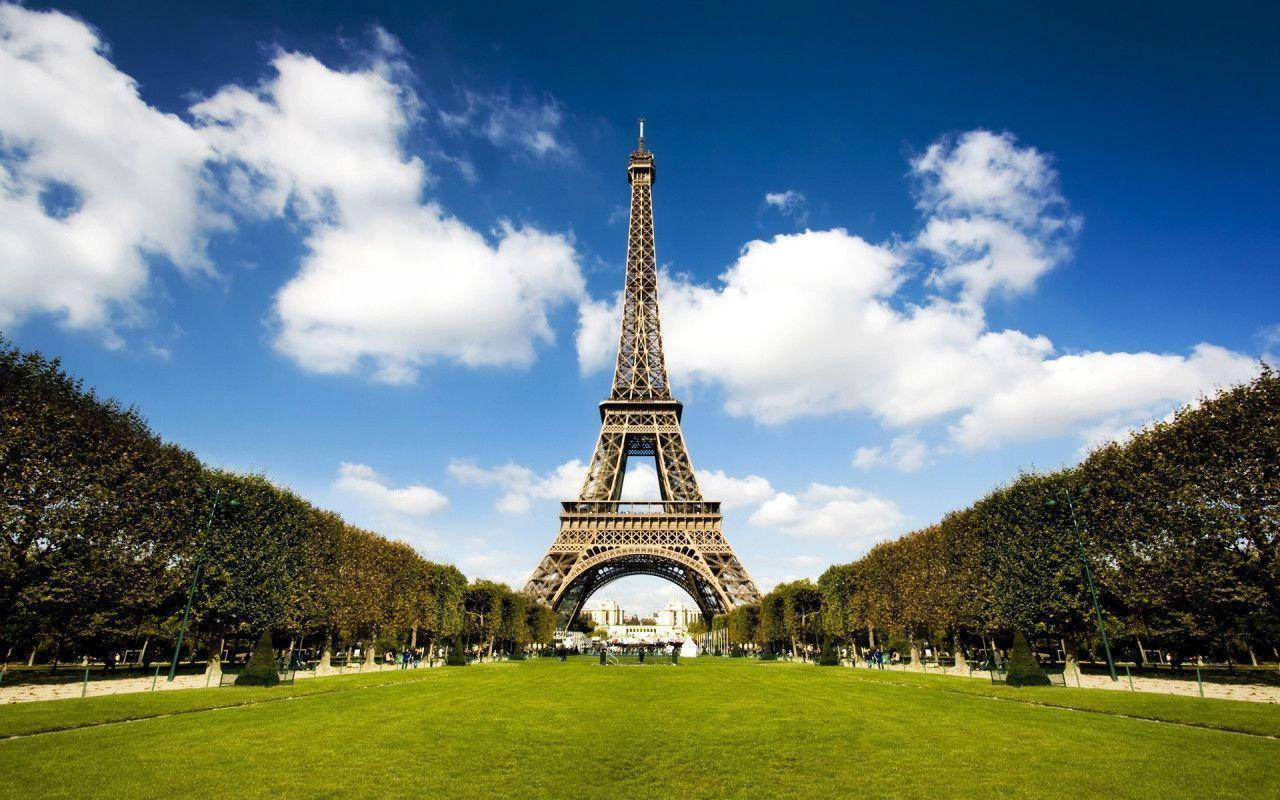 Eiffel Tower, vibrant blue sky, fluffy white clouds, HD Desktop Wallpaper