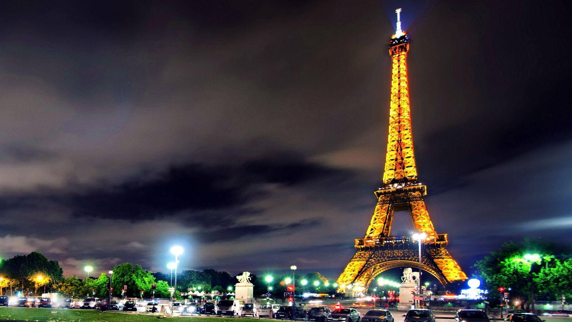Eiffel Tower, dark cloudy night sky, city lights, Full HD Desktop Wallpaper