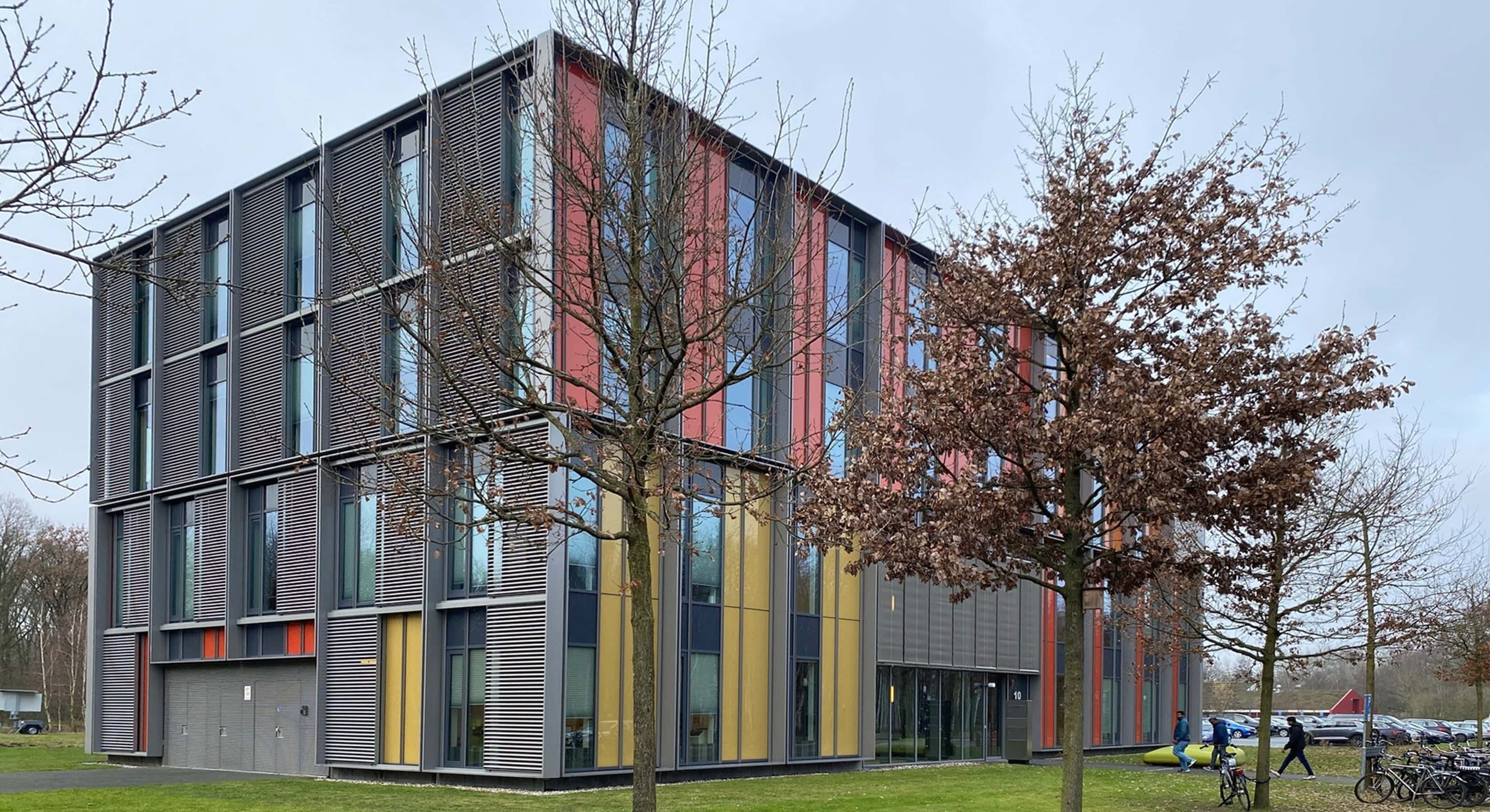 Eindhoven, modern angular building, gray metal panels, 2K Desktop Wallpaper