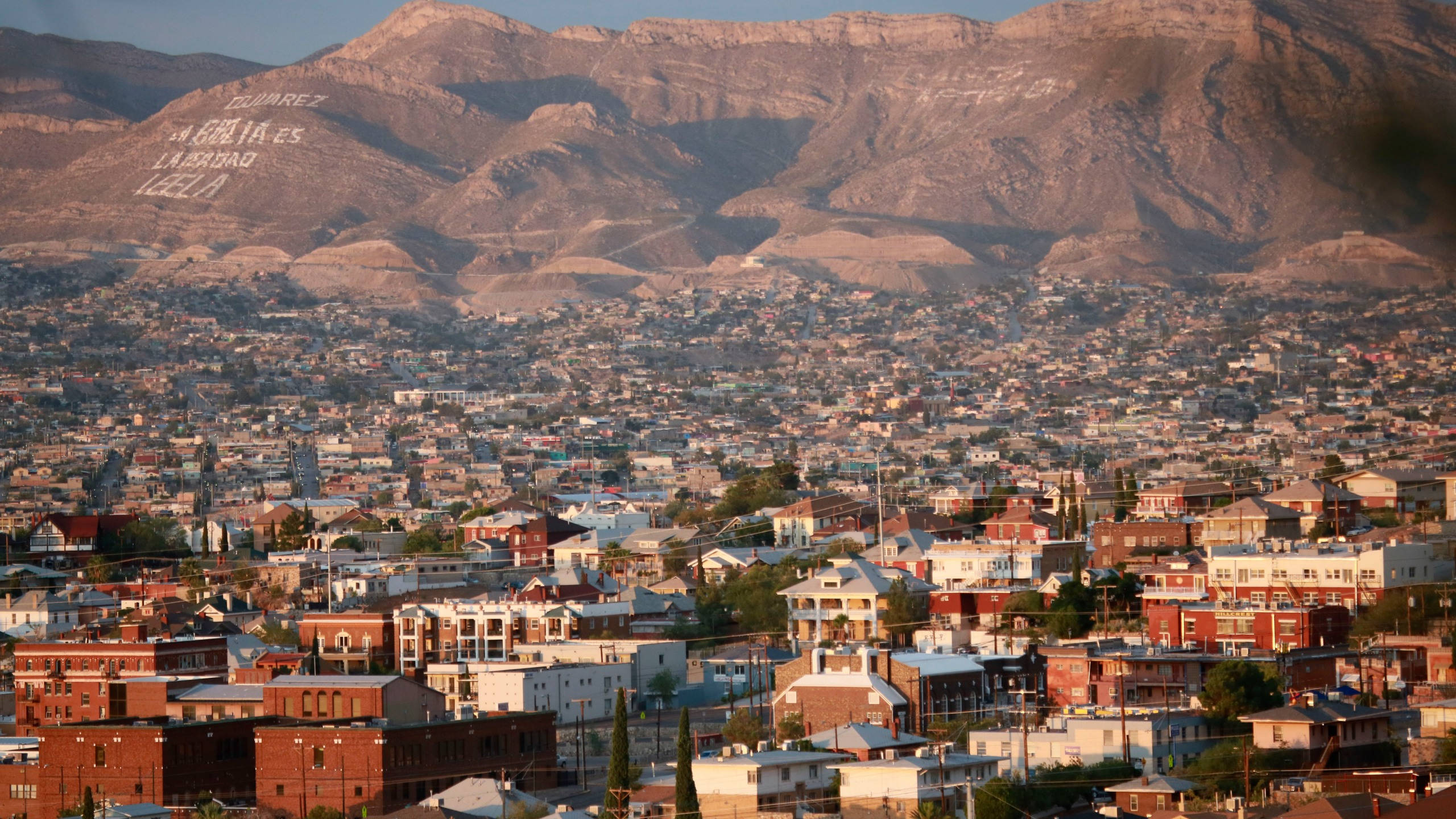 El Paso, sunlit mountains, large white graffiti text, 2K Desktop Wallpaper