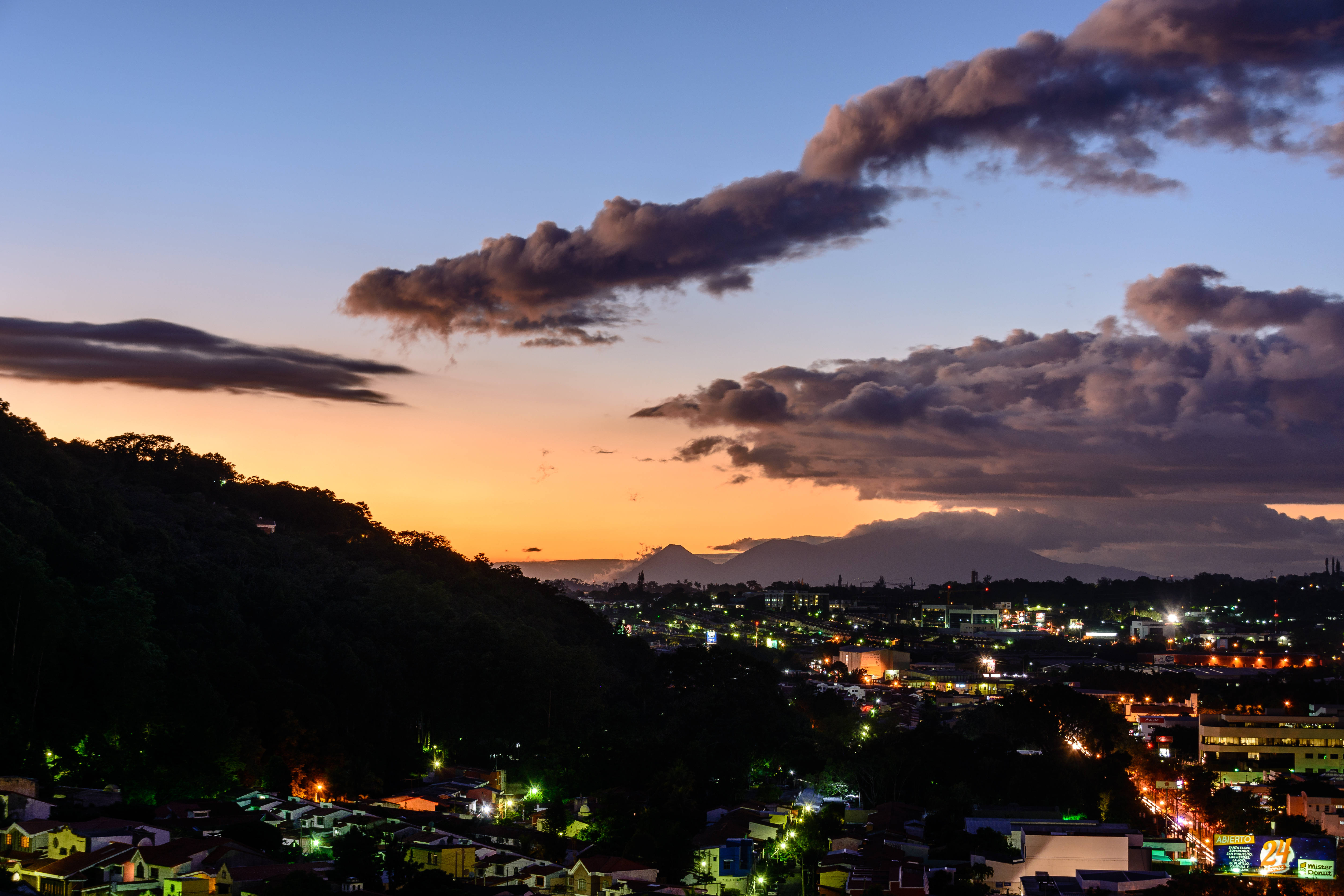 El Salvador, dusky city, warm orange sunset hues, 5K Desktop Wallpaper