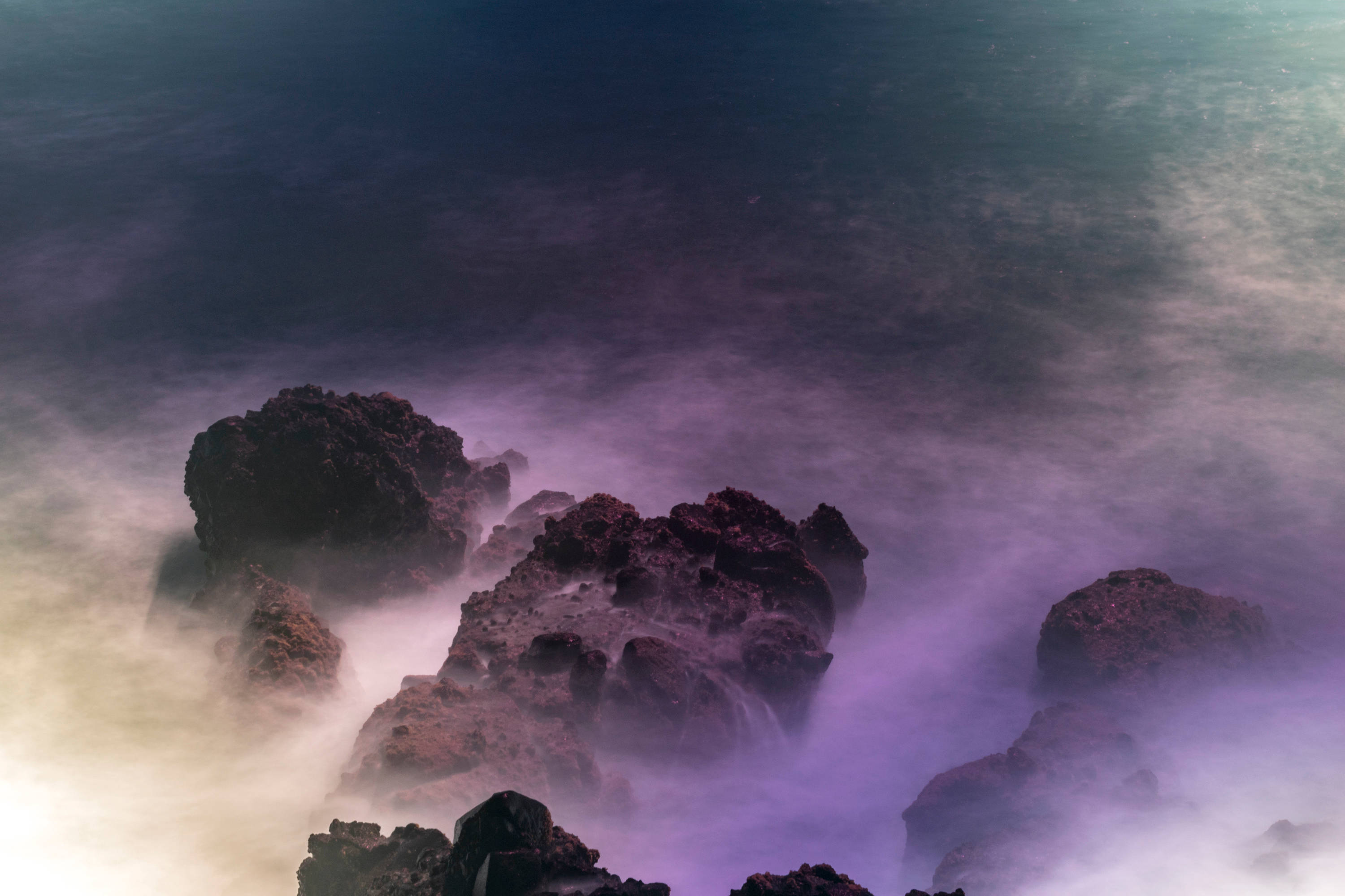 El Salvador, rocky shore, misty purple and blue ocean waves, 2K Desktop Wallpaper