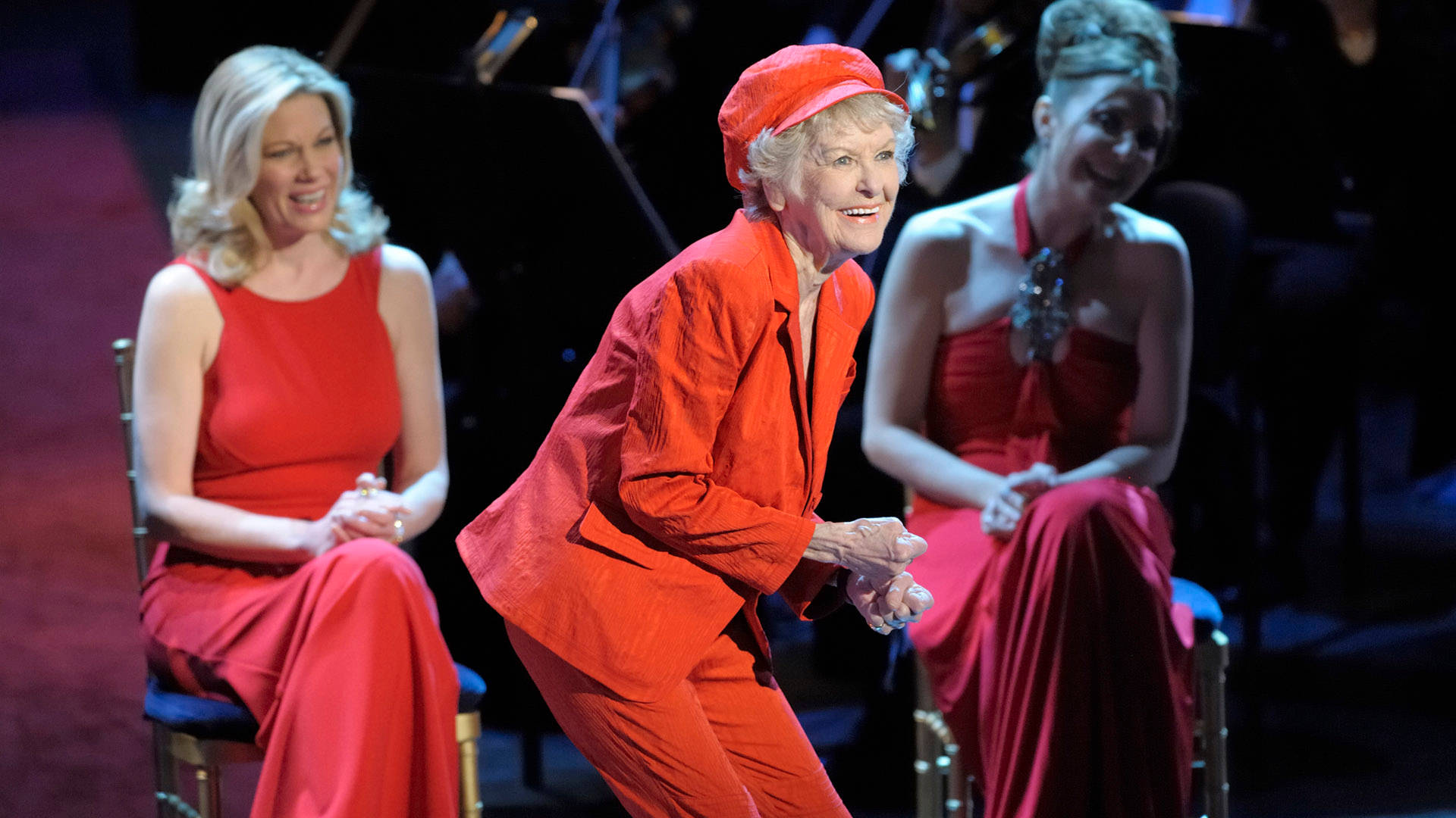 Elaine Stritch, red attire, dimly lit stage, Full HD Desktop Wallpaper