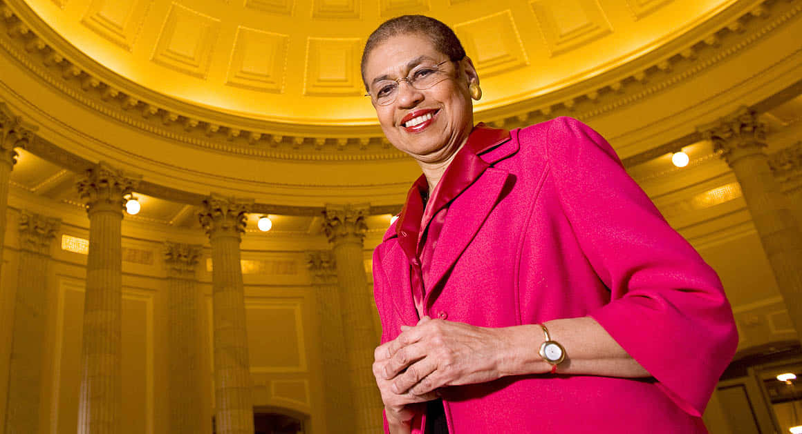 Eleanor Holmes Norton, vibrant pink blazer, grand classical building, SD Desktop Wallpaper