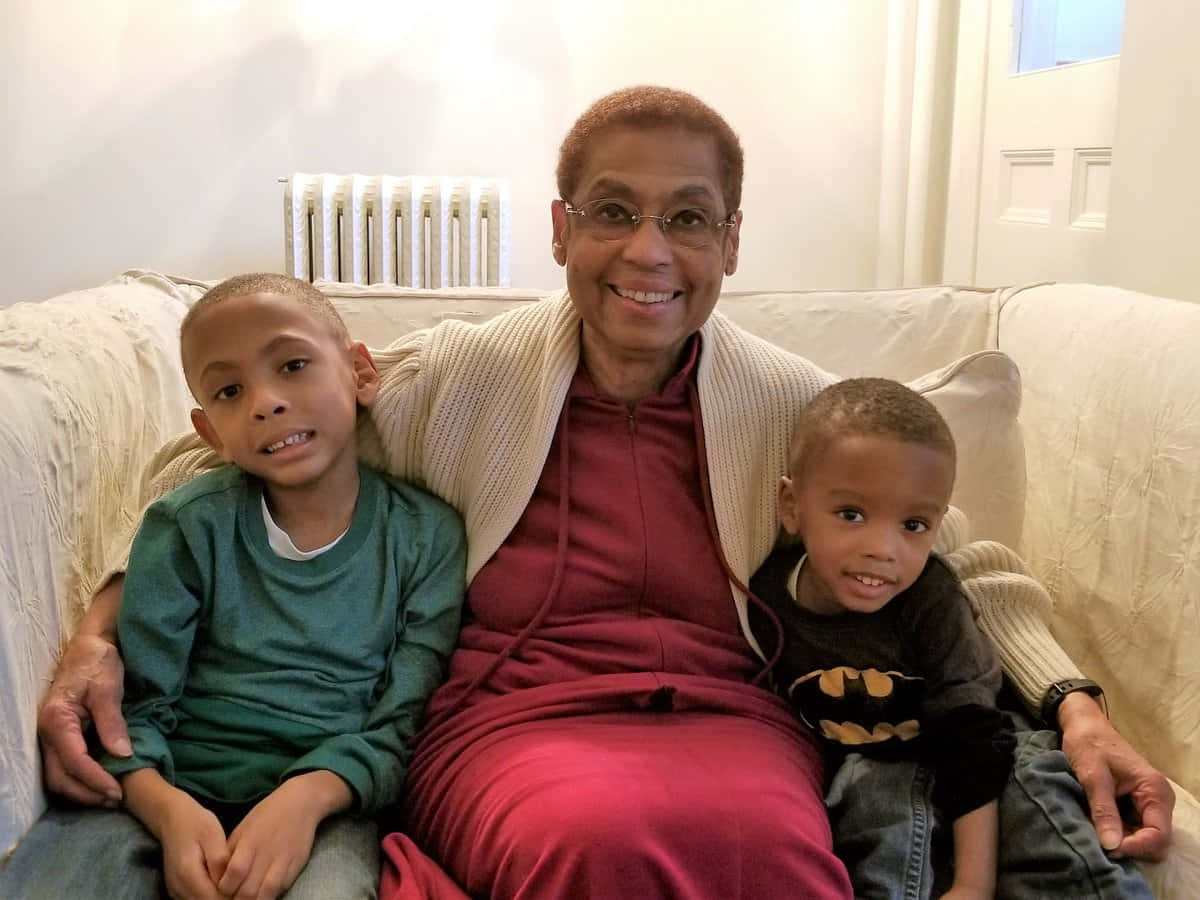 Eleanor Holmes Norton, beige couch, green shirt, SD Desktop Wallpaper