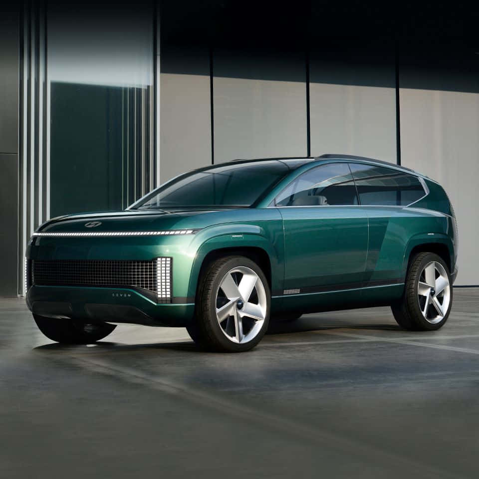 futuristic green SUV, glowing LED headlights, minimalist modern garage, SD Desktop Wallpaper