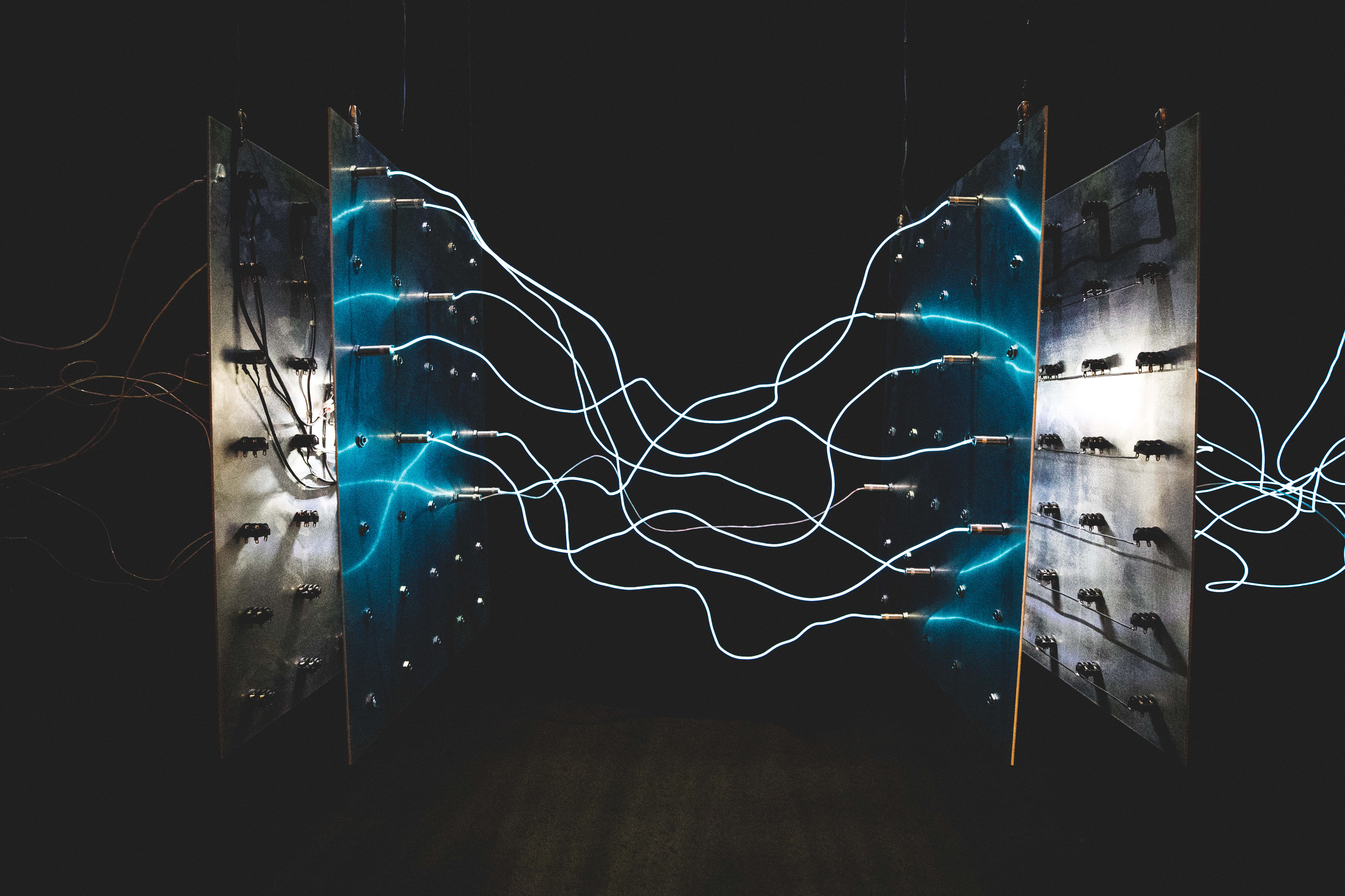switchboard, glowing blue and white neon lines, metallic panels, 5K Desktop Wallpaper