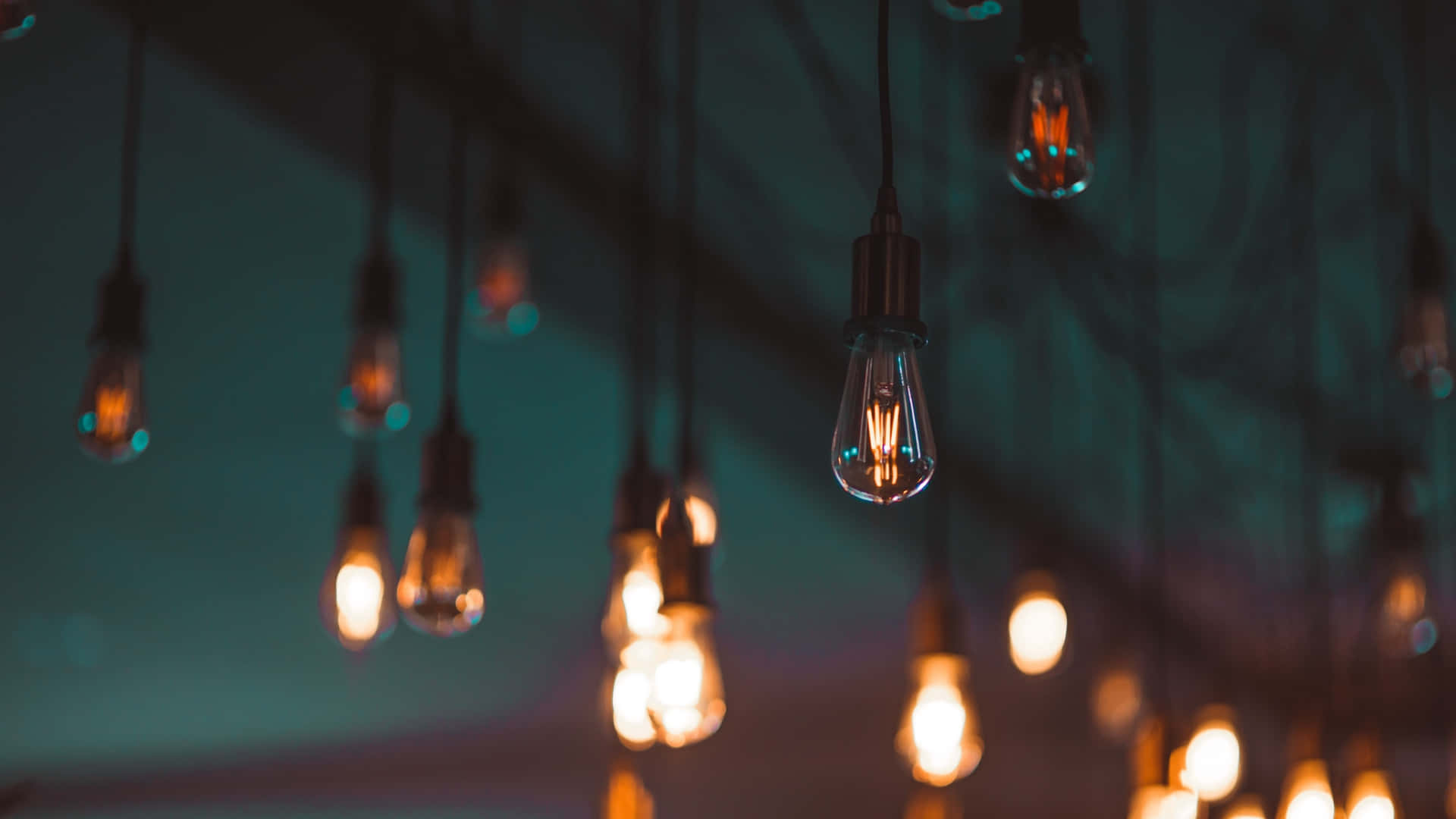vintage light bulbs, cool teal backdrop, cozy industrial ambiance, Full HD Desktop Wallpaper