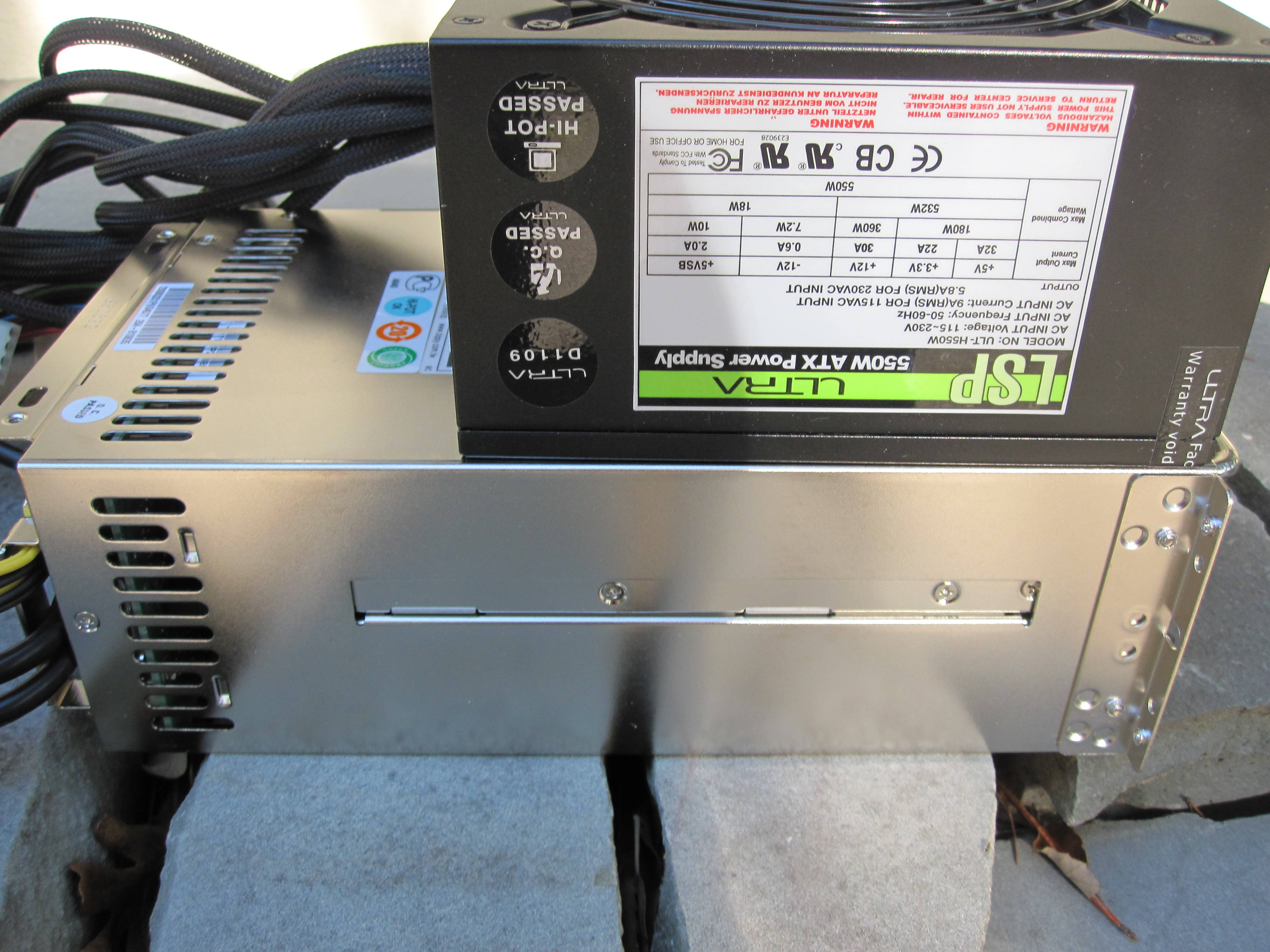 550W ATX power supply unit, black and silver, visible cables, 4K Desktop Wallpaper