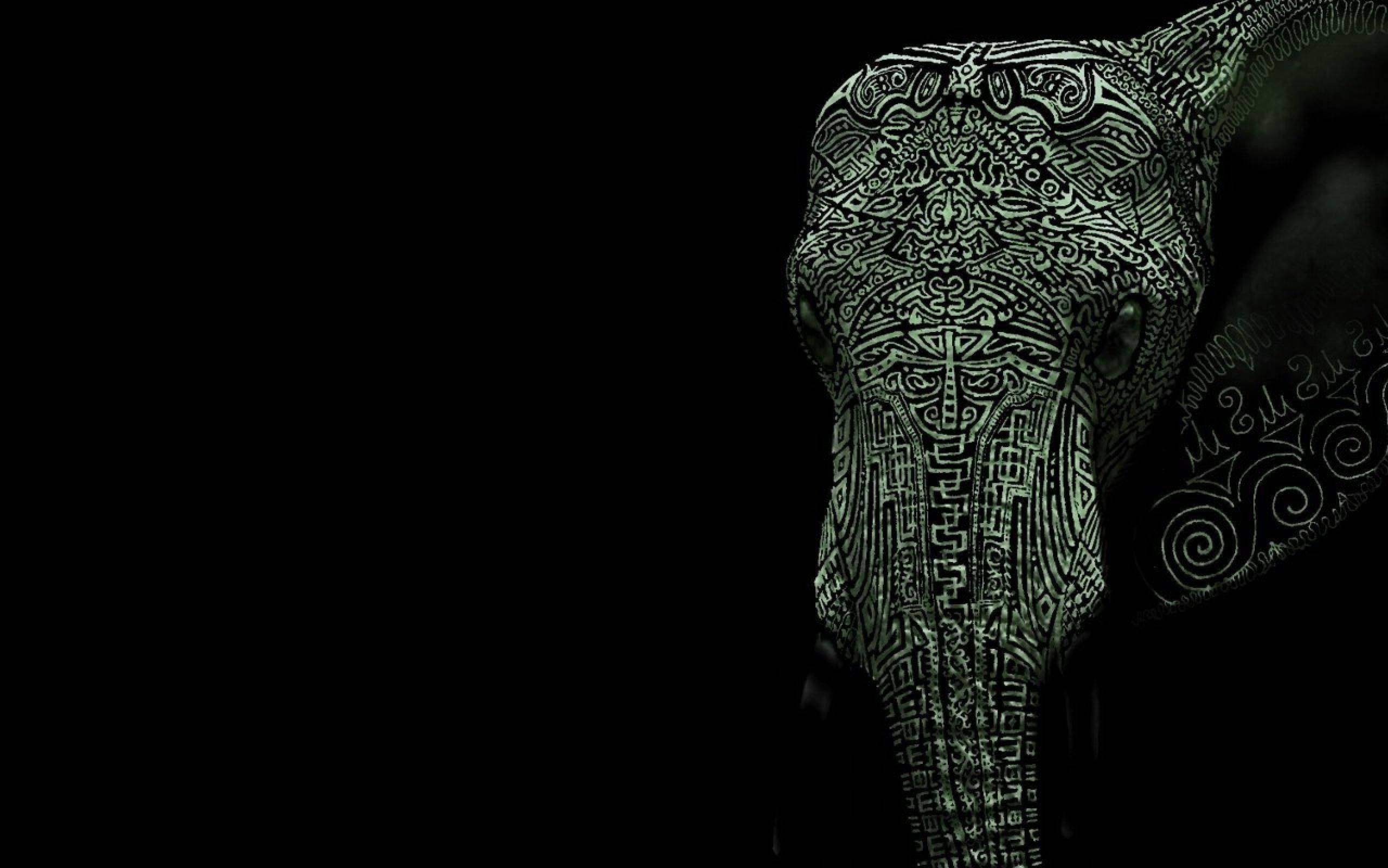 tribal elephant, glowing green, stark black background, 2K Desktop Wallpaper