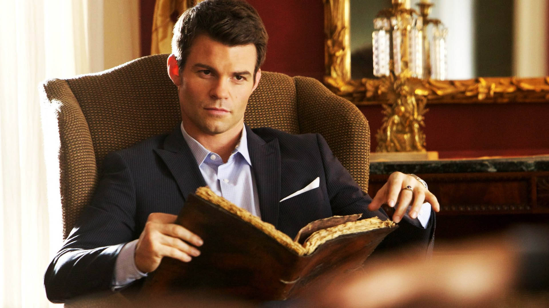 Elijah Mikaelson, dark suit, plush armchair, Full HD Desktop Wallpaper