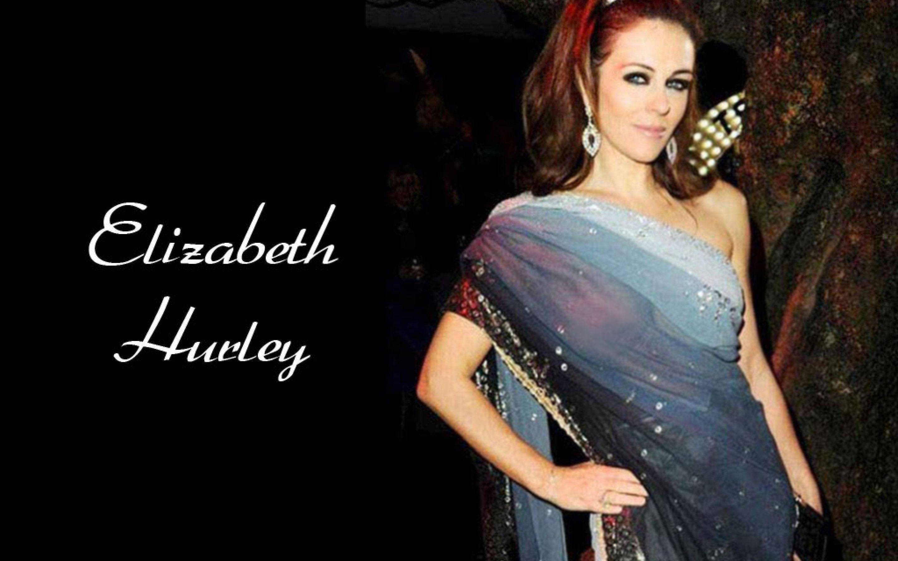 Elizabeth Hurley, shimmering blue saree, gold trim, 2K Desktop Wallpaper