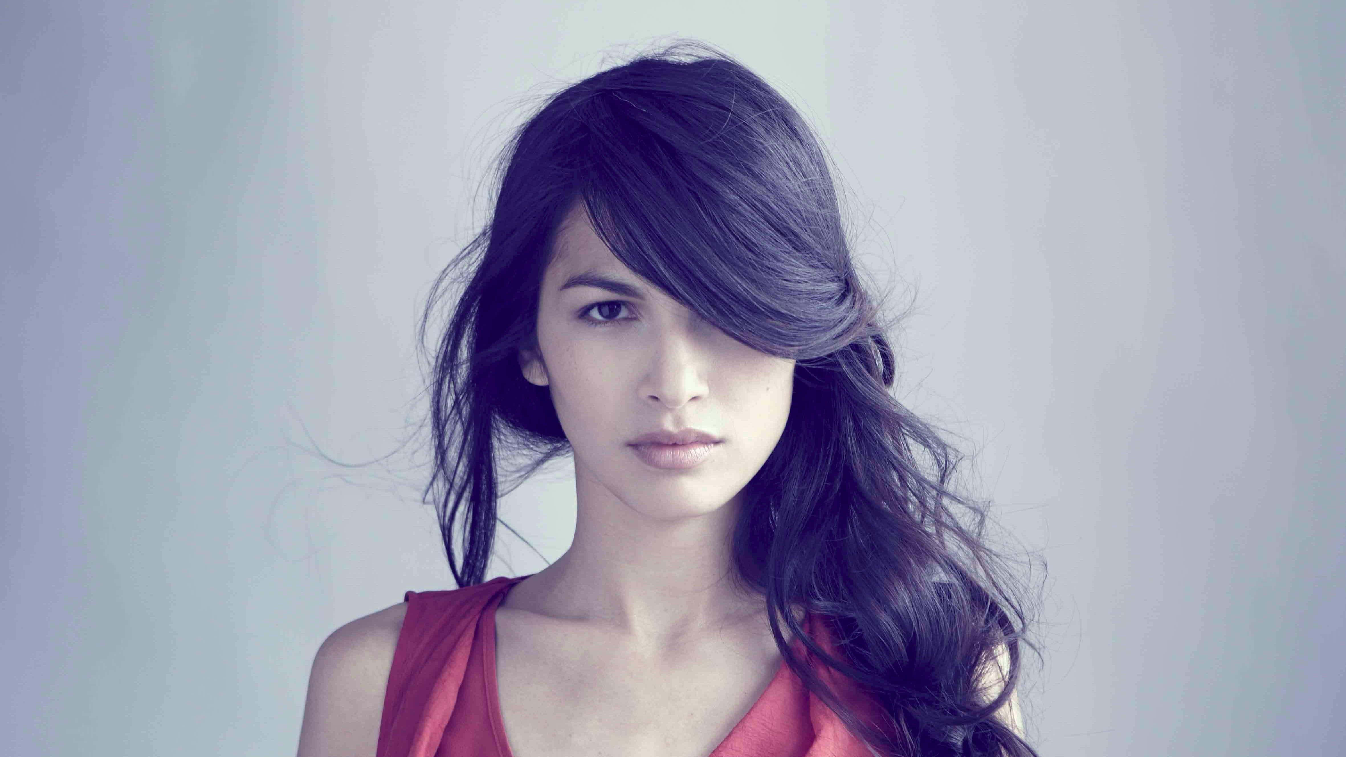 Elodie Yung, dark wavy hair, red top, 4K Desktop Wallpaper