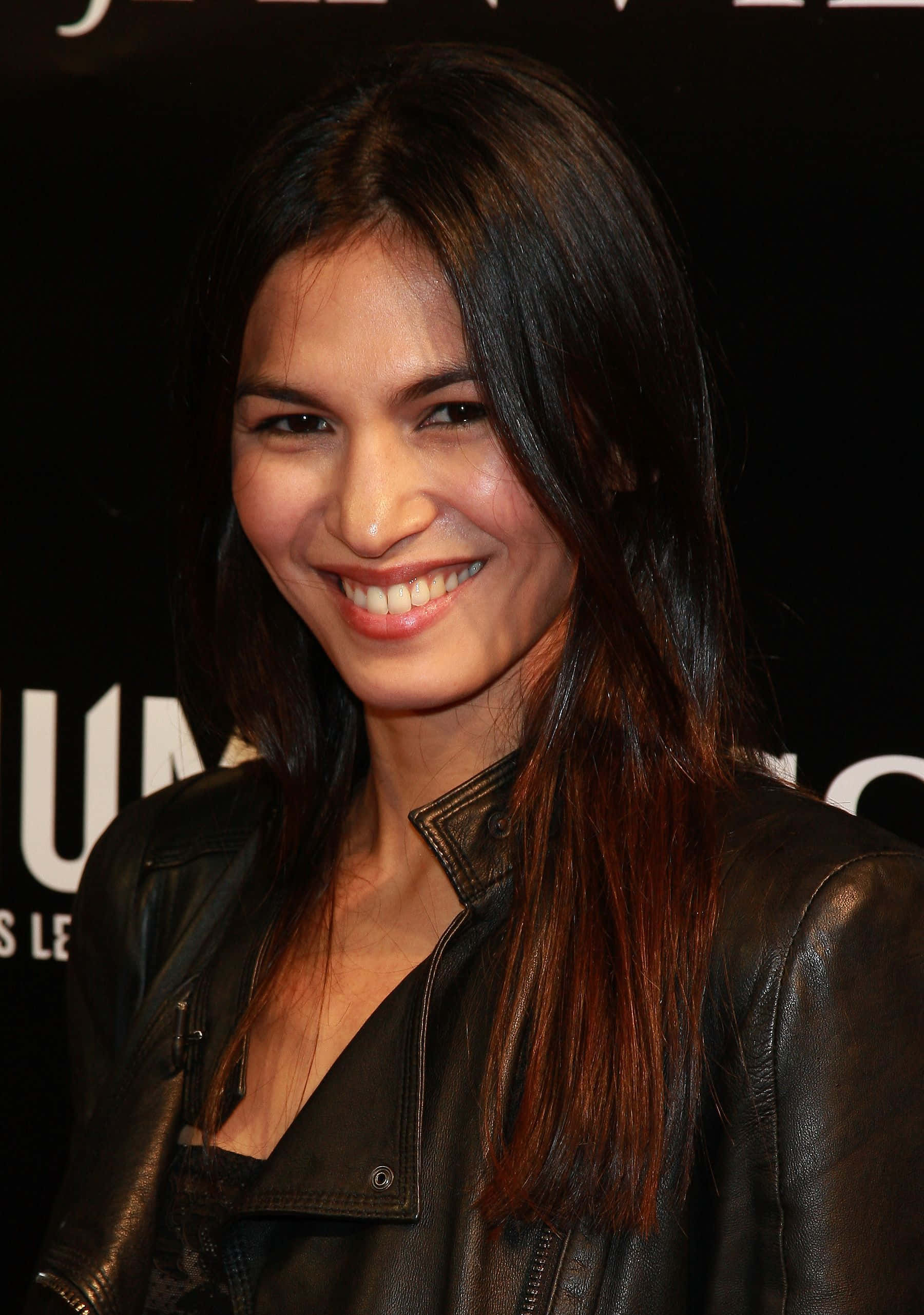 Elodie Yung, long dark hair, black leather jacket, 2K Phone Wallpaper