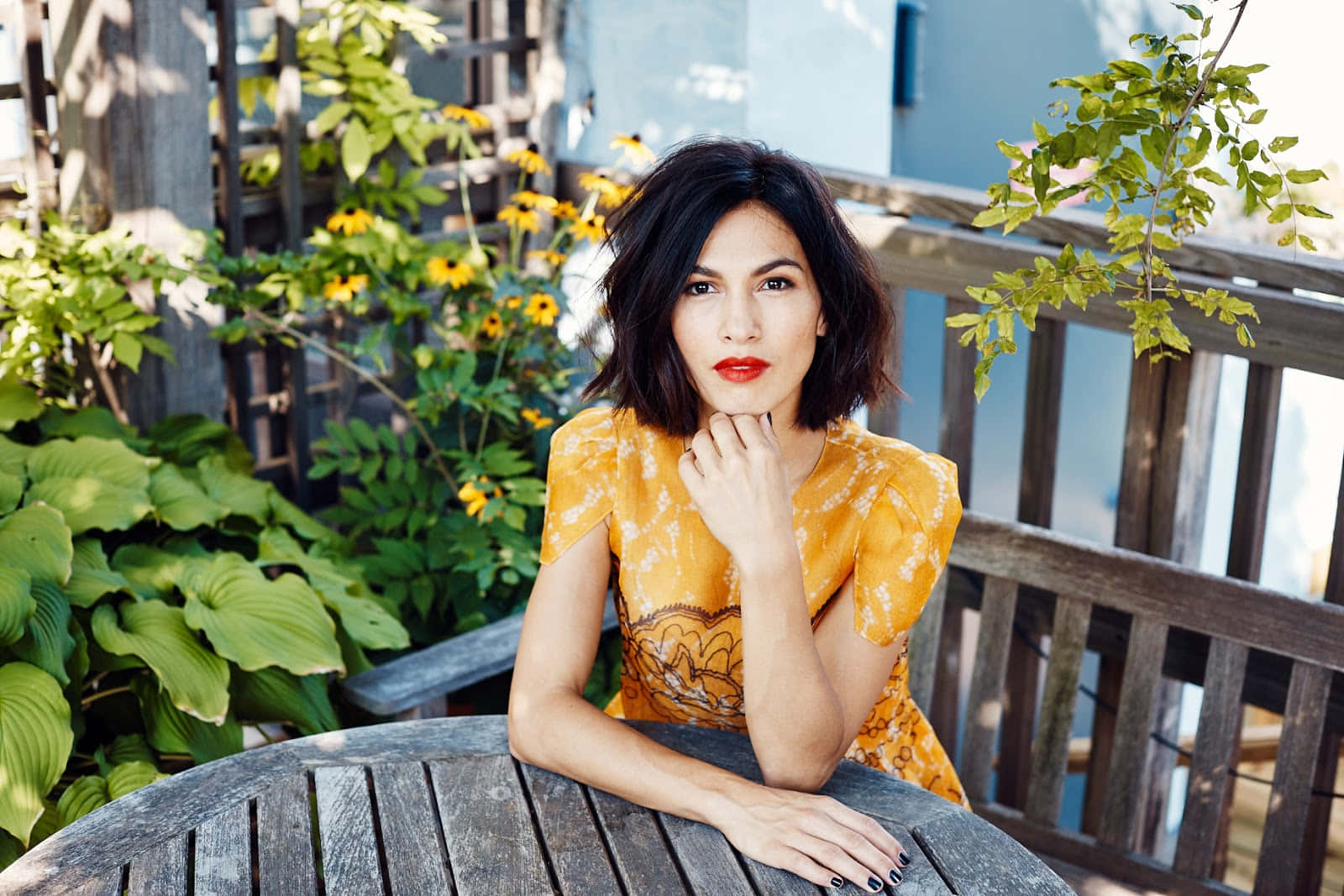 Elodie Yung, yellow patterned dress, wooden table, HD Desktop Wallpaper