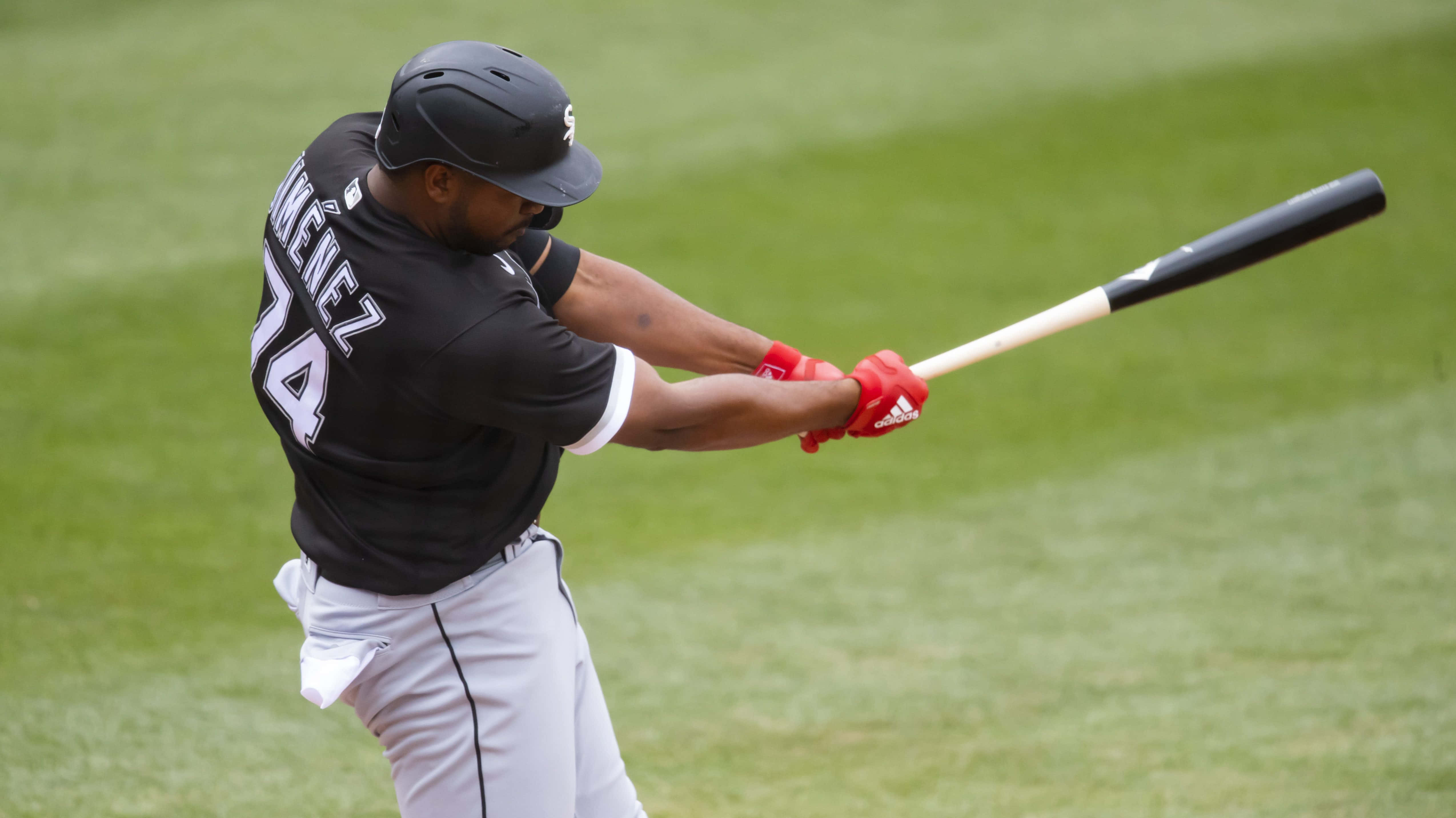 Eloy Jimenez, black jersey, red gloves, 4K Desktop Wallpaper