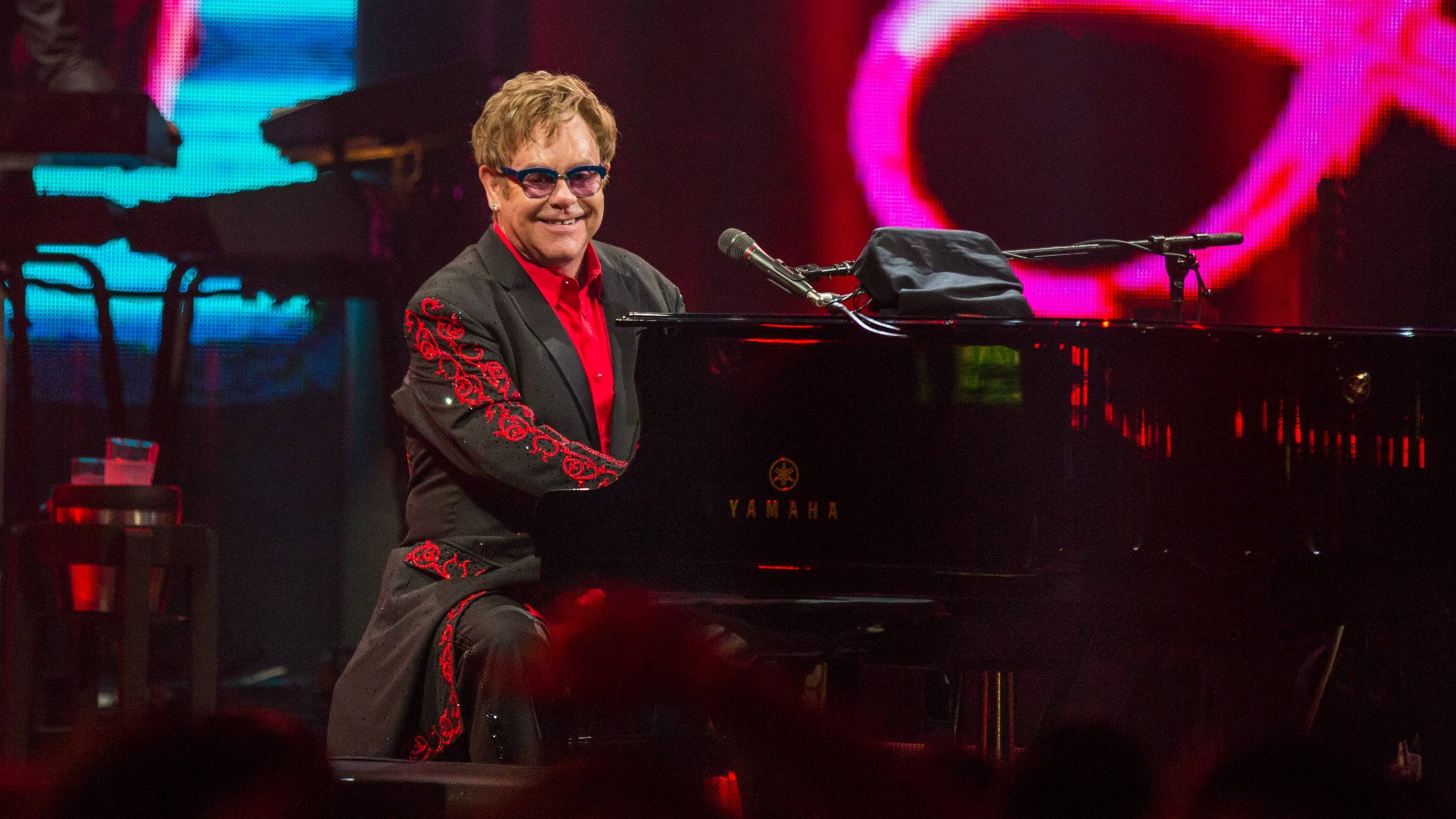 Elton John, grand piano, vibrant stage lights, 5K Desktop Wallpaper