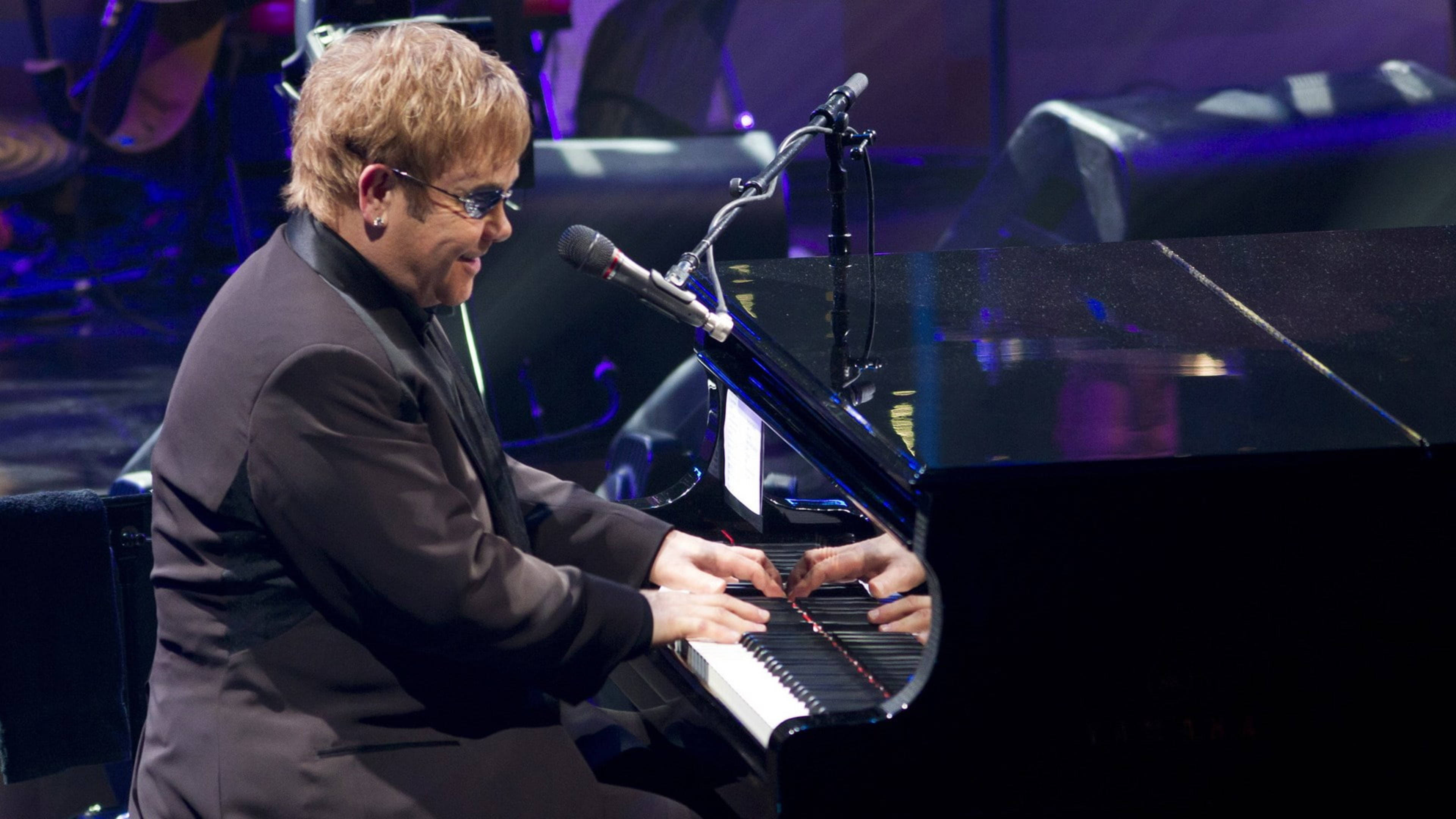 Elton John, grand piano, purple stage lights, 4K Desktop Wallpaper