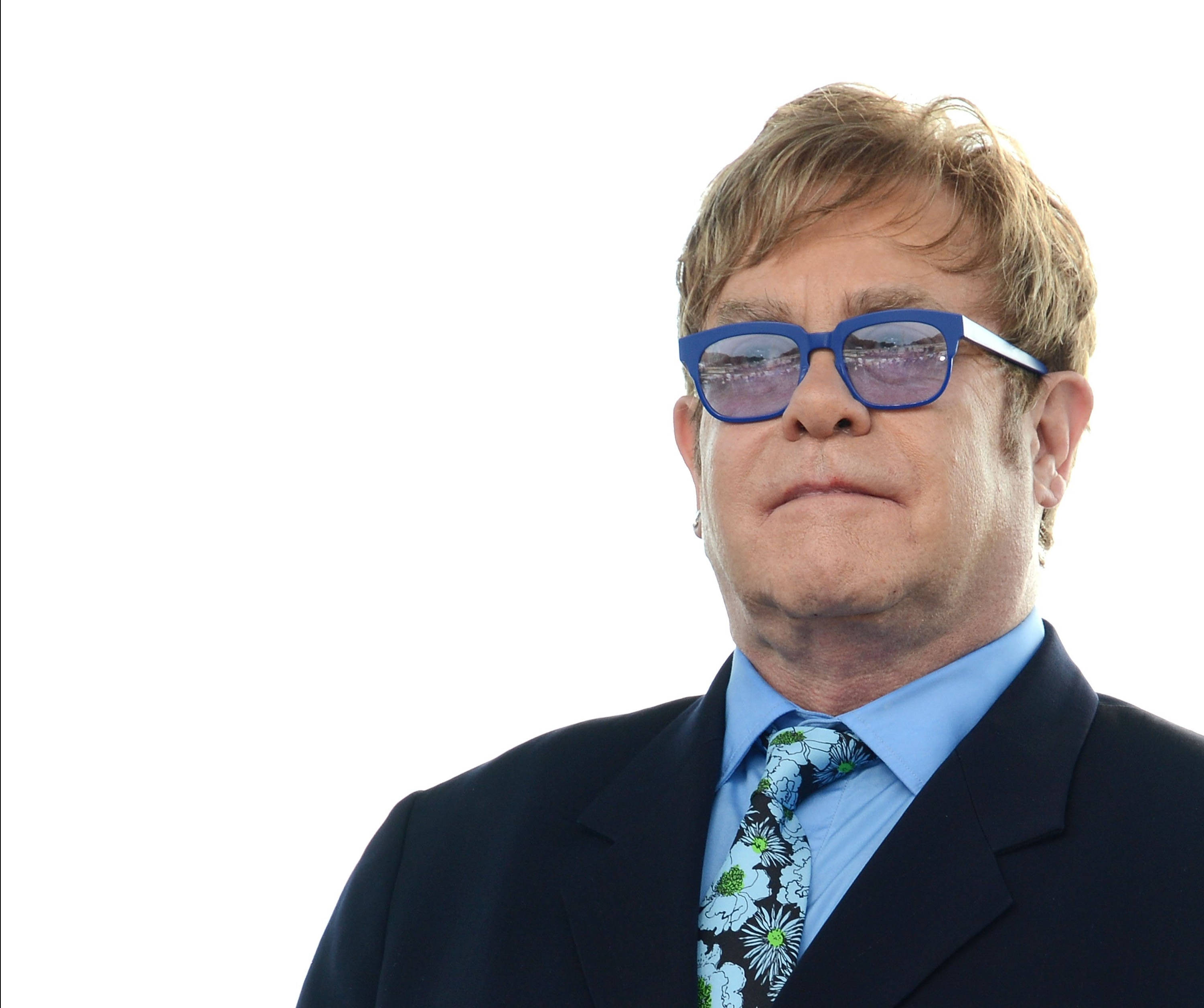Elton John, dark suit, floral tie, 2K Desktop Wallpaper