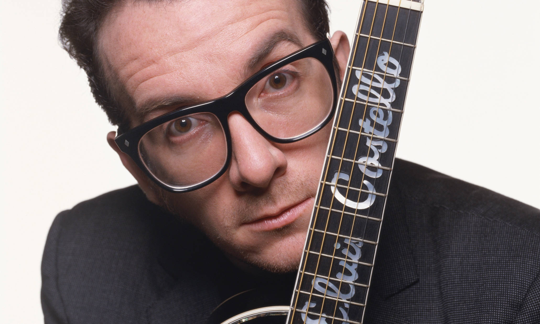 Elvis Costello, thick black-rimmed glasses, guitar neck, Full HD Desktop Wallpaper