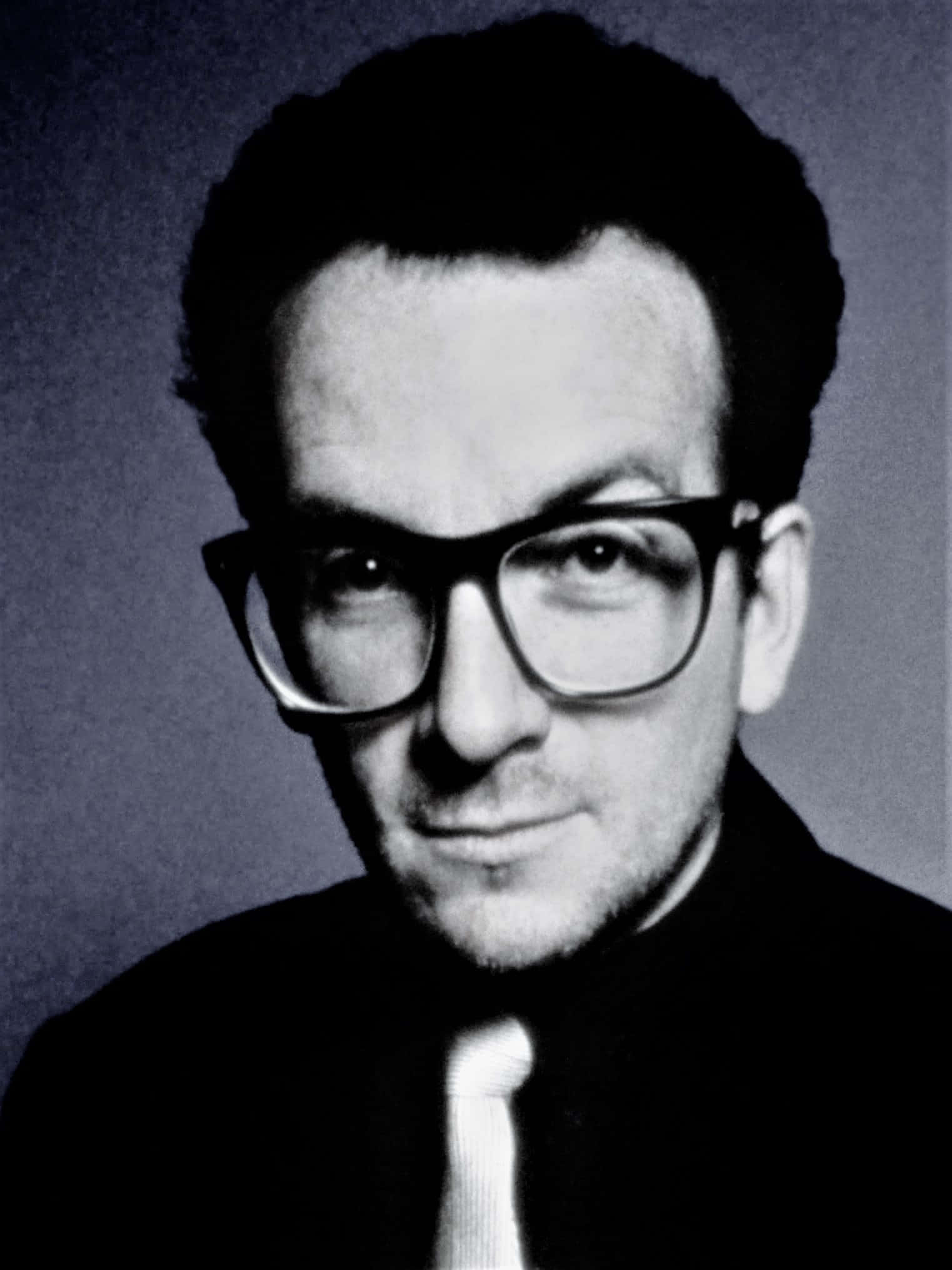 Elvis Costello, thick-rimmed glasses, muted gray background, Full HD Phone Wallpaper