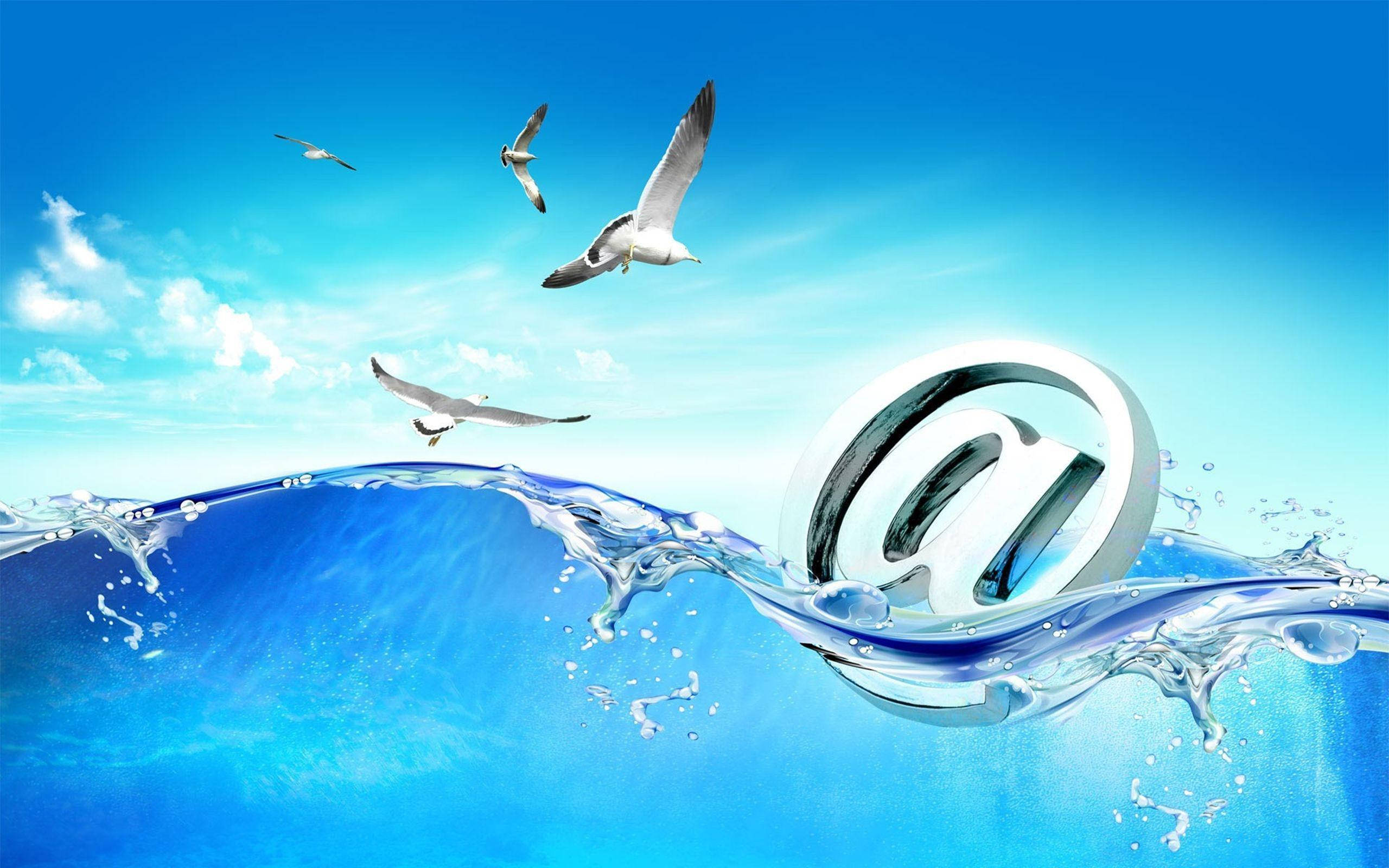 at symbol, glossy silver, blue ocean waves, 2K Desktop Wallpaper