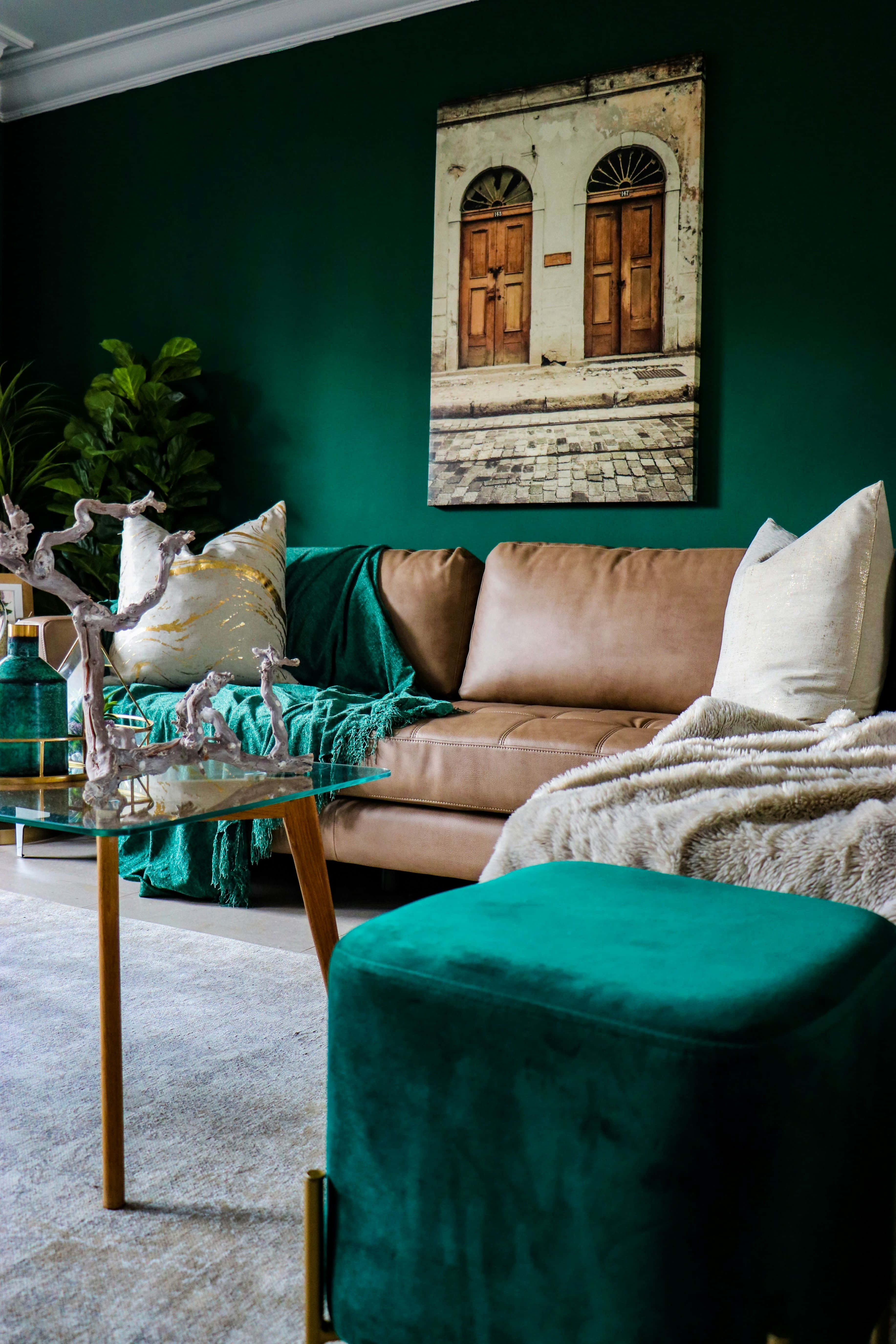 emerald green wall, tan leather sofa, white pillows, 5K Phone Wallpaper