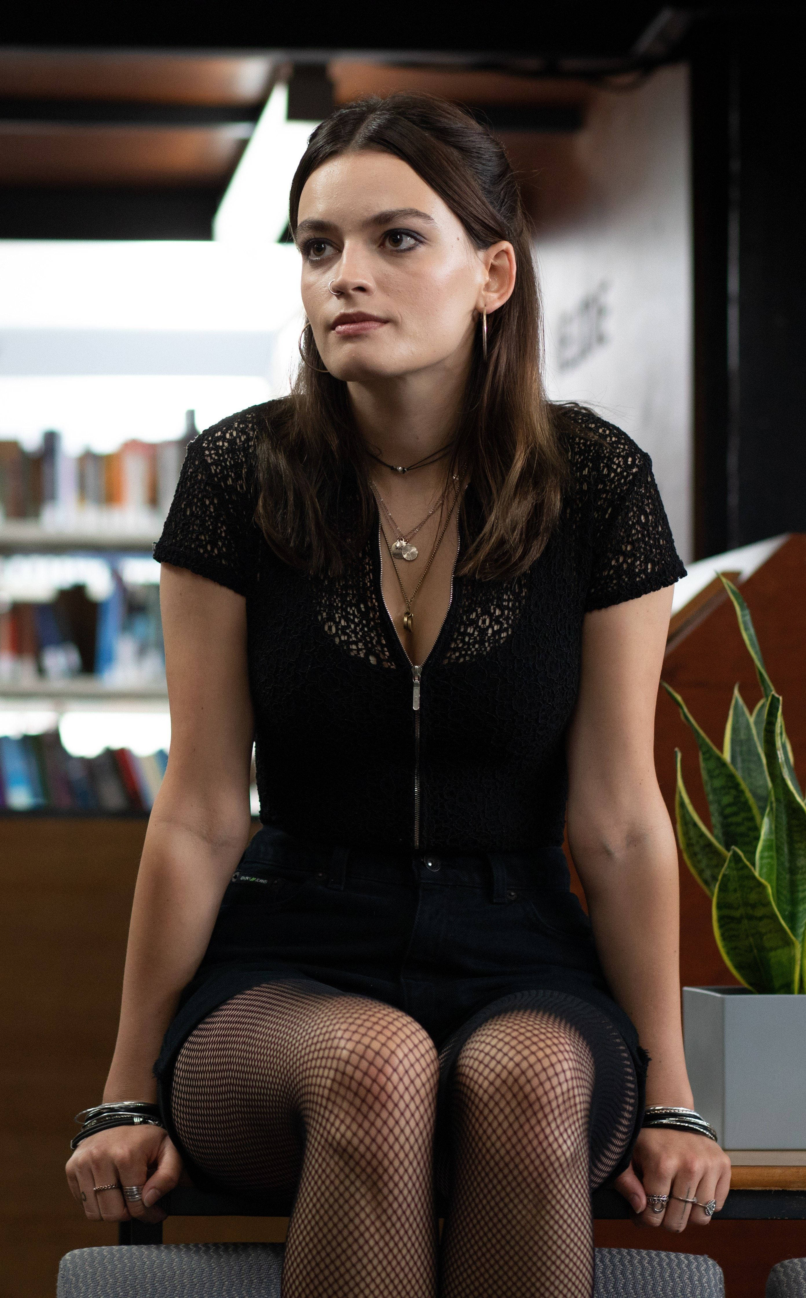 Emma Mackey, black lace top, fishnet stockings, 4K Phone Wallpaper