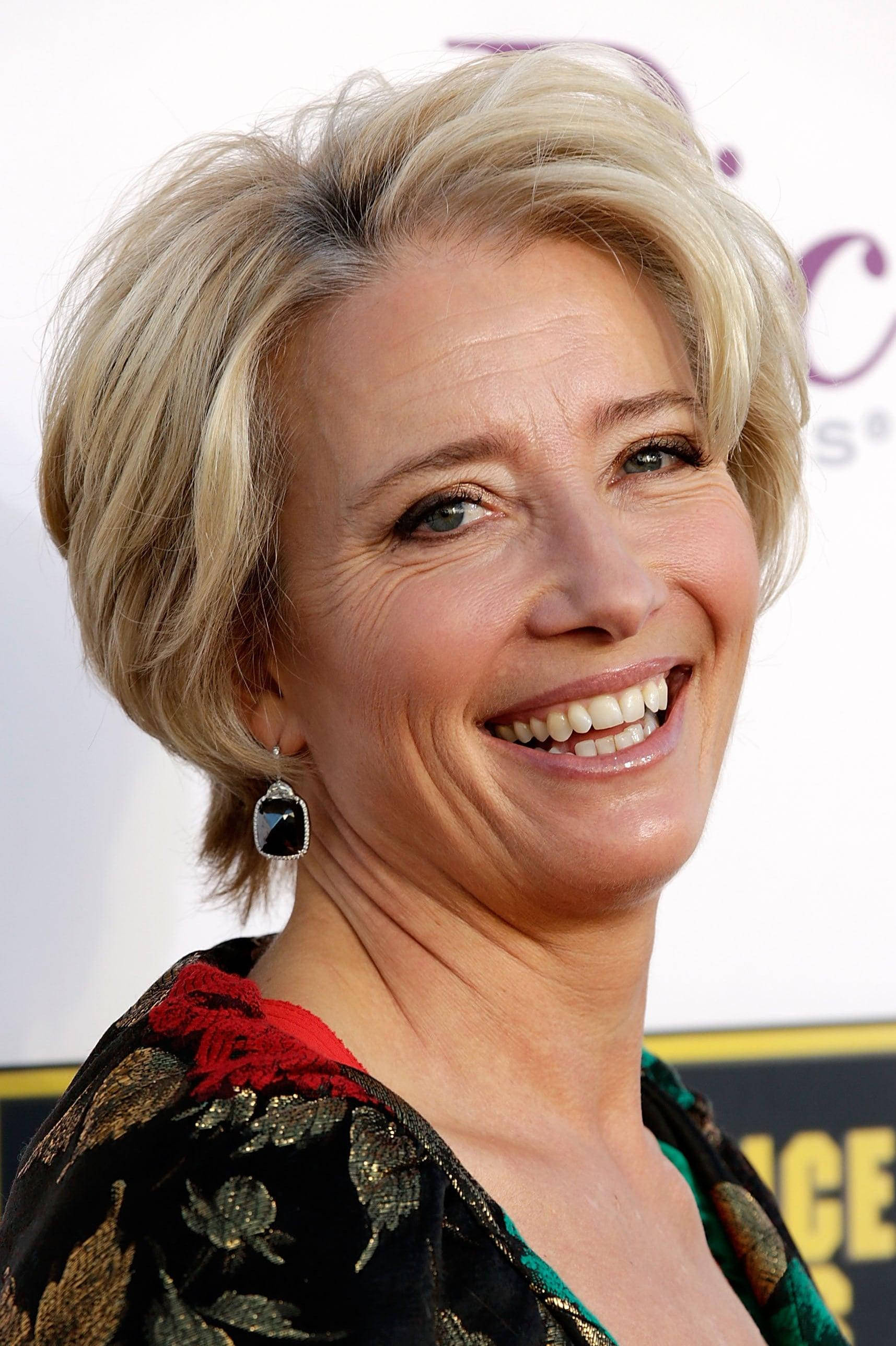 Emma Thompson, short blonde hair, bright smile, 2K Phone Wallpaper