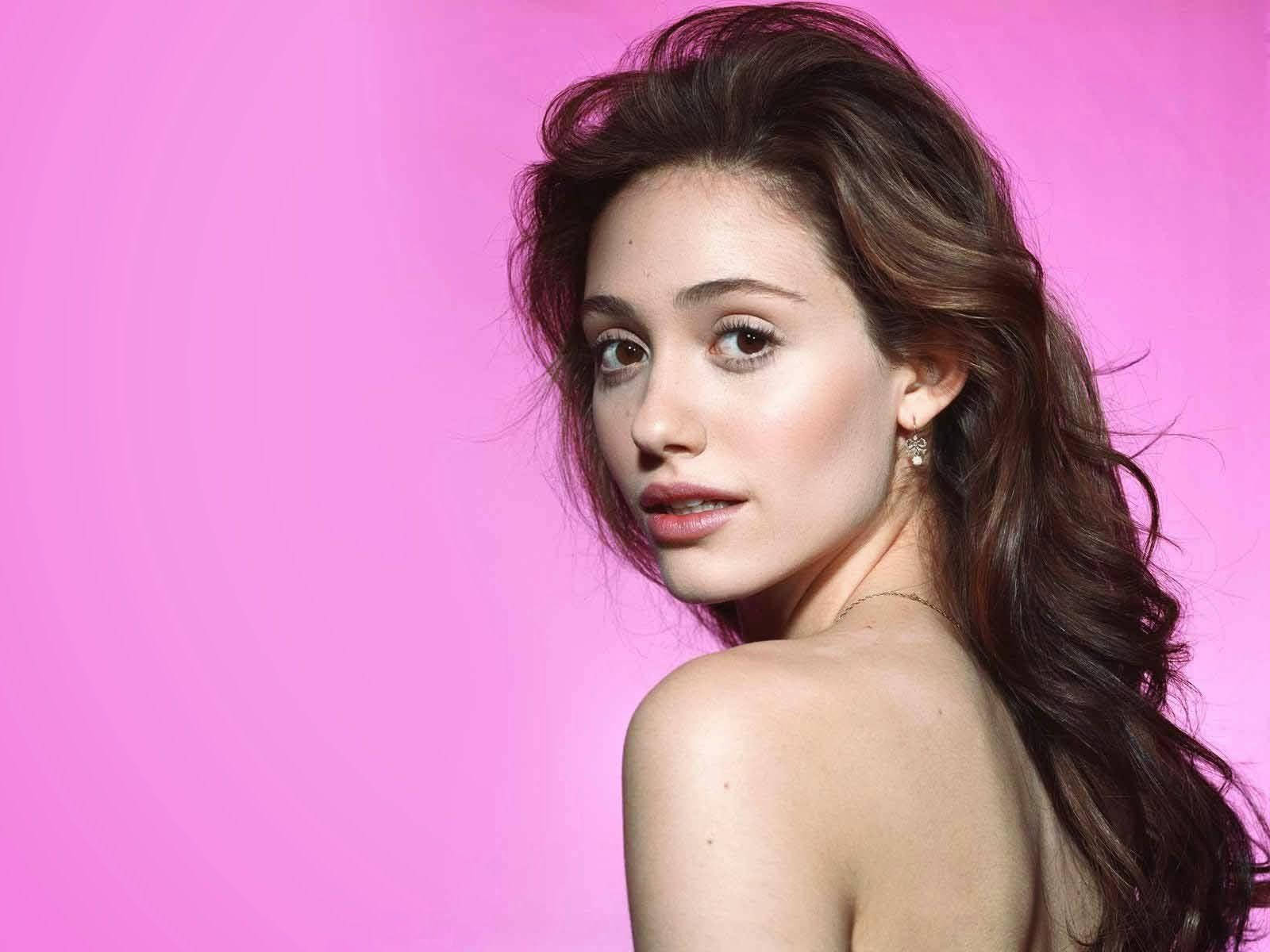 Emmy Rossum, wavy brown hair, solid pink background, HD Desktop Wallpaper