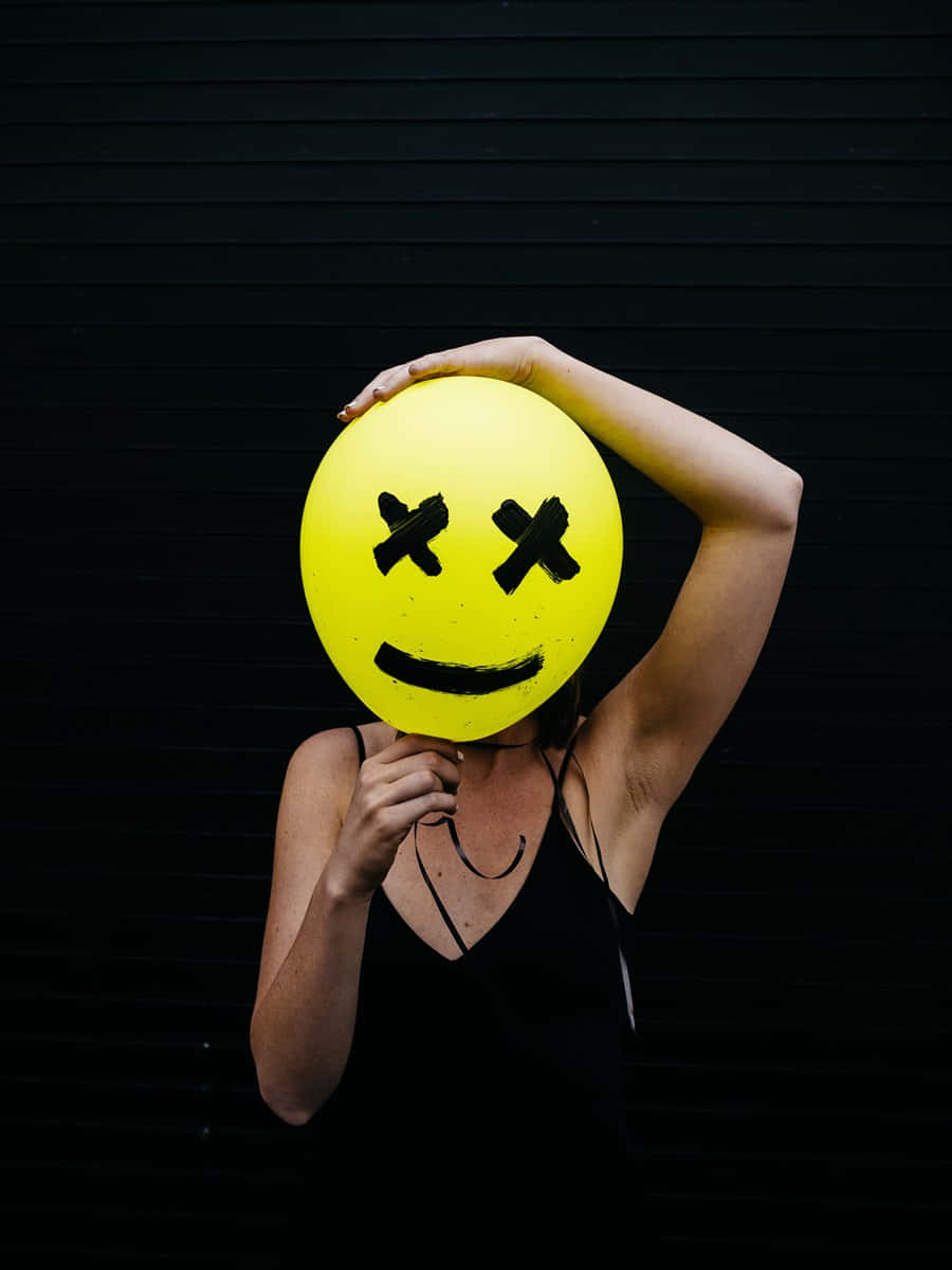 yellow smiley face balloon, dead smiley face, black background, SD Phone Wallpaper