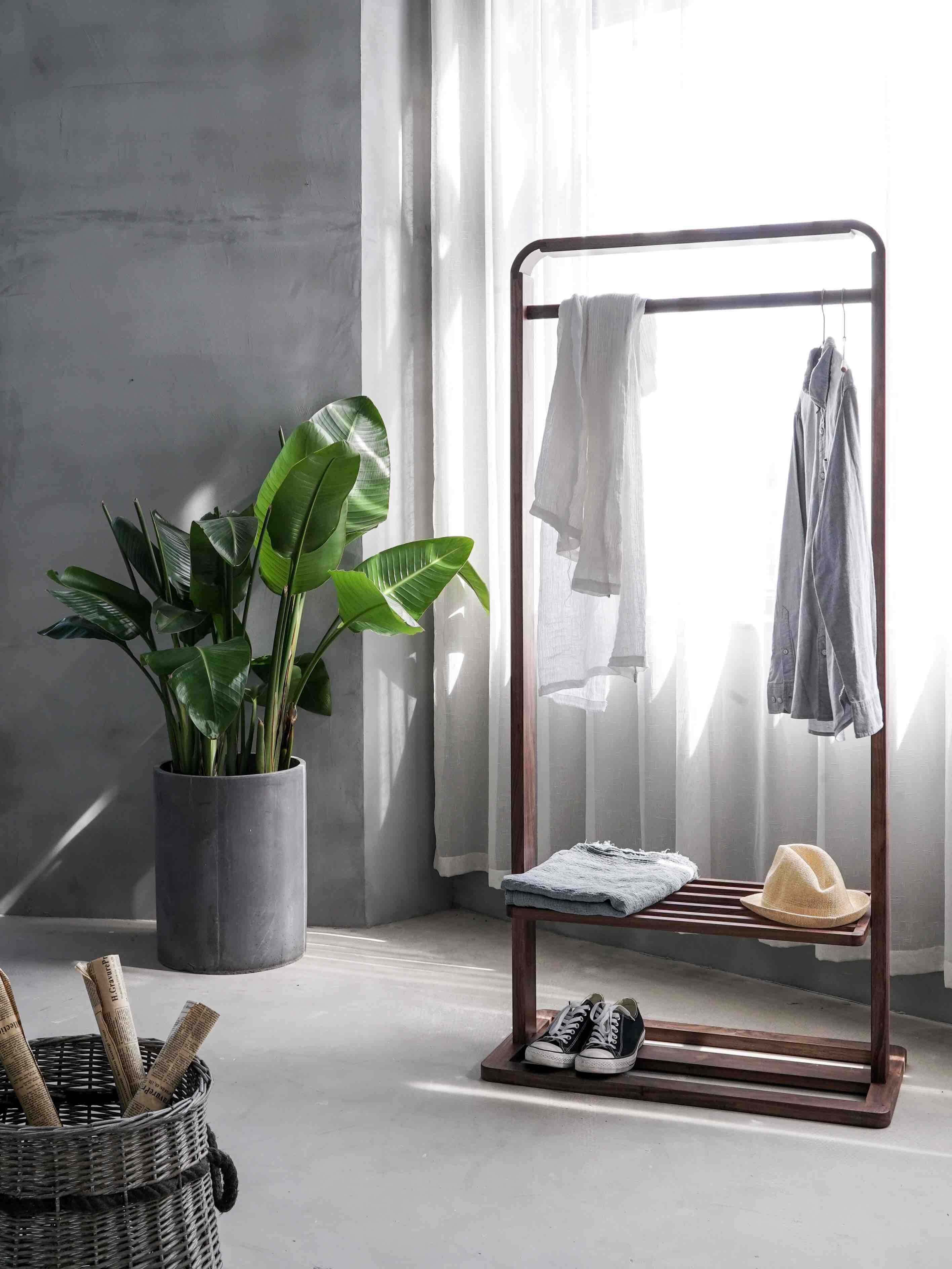 minimalist modern room, wooden coat rack, large potted plant, 2K Phone Wallpaper