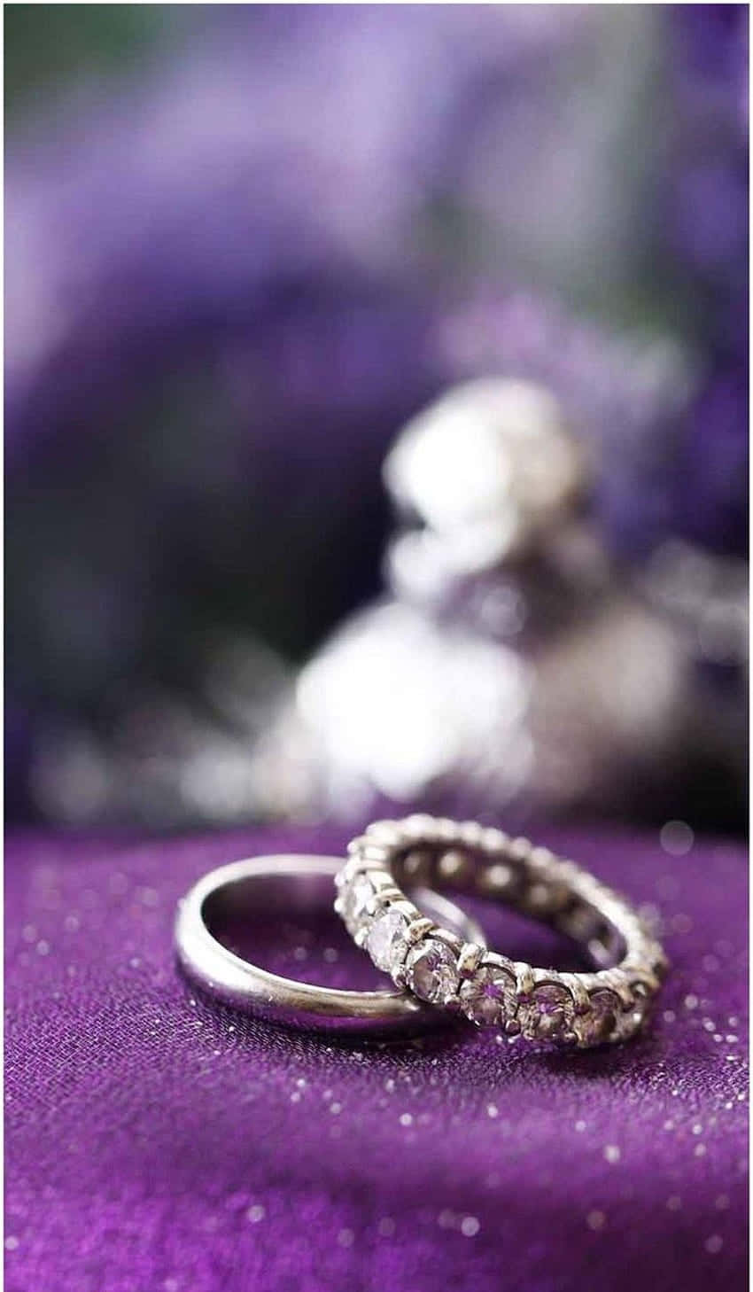 diamond studded silver engagement rings, glittering purple fabric, blurred floral background, HD Phone Wallpaper