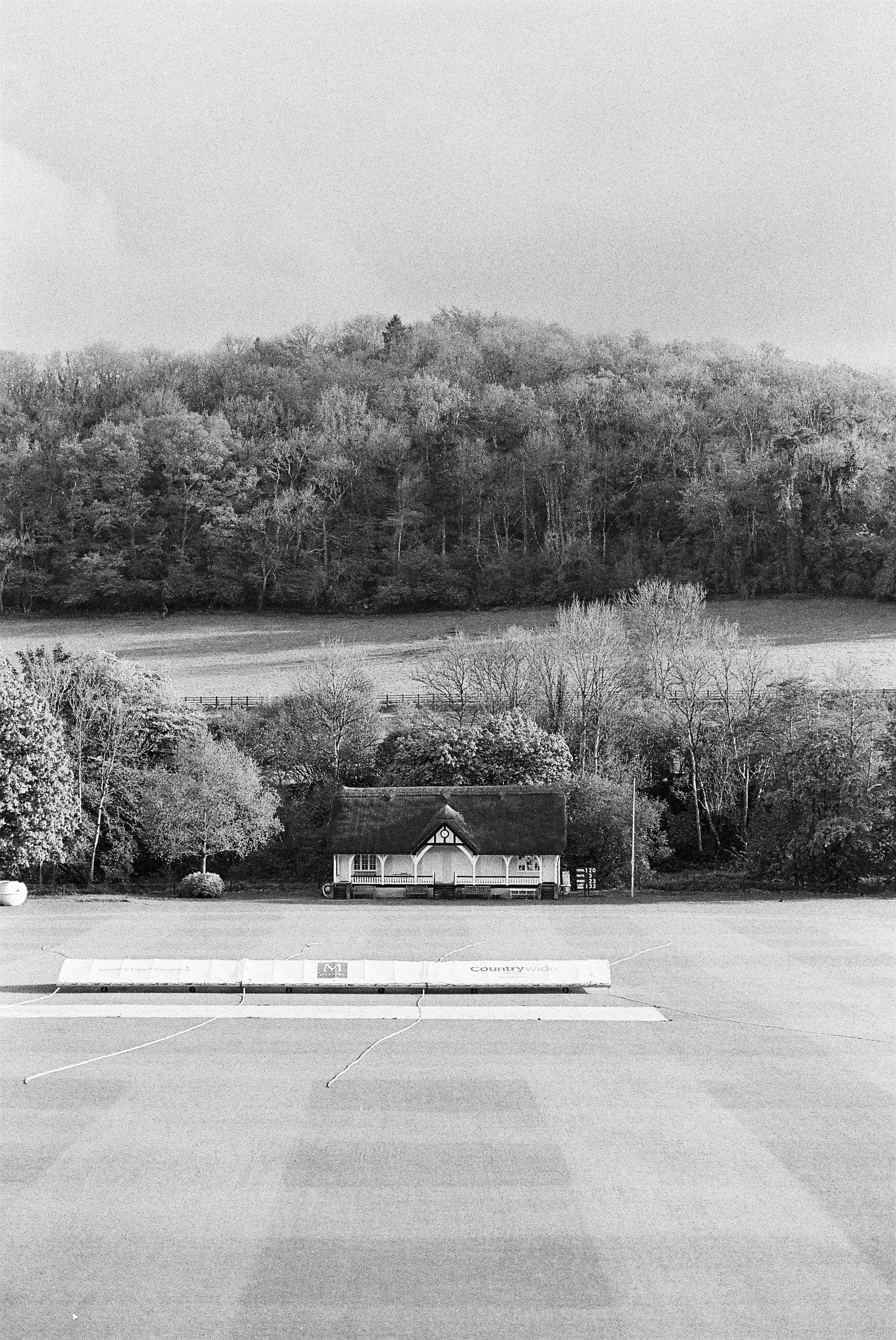 cricket pitch, thatched cottage, wooded valley, 2K Phone Wallpaper