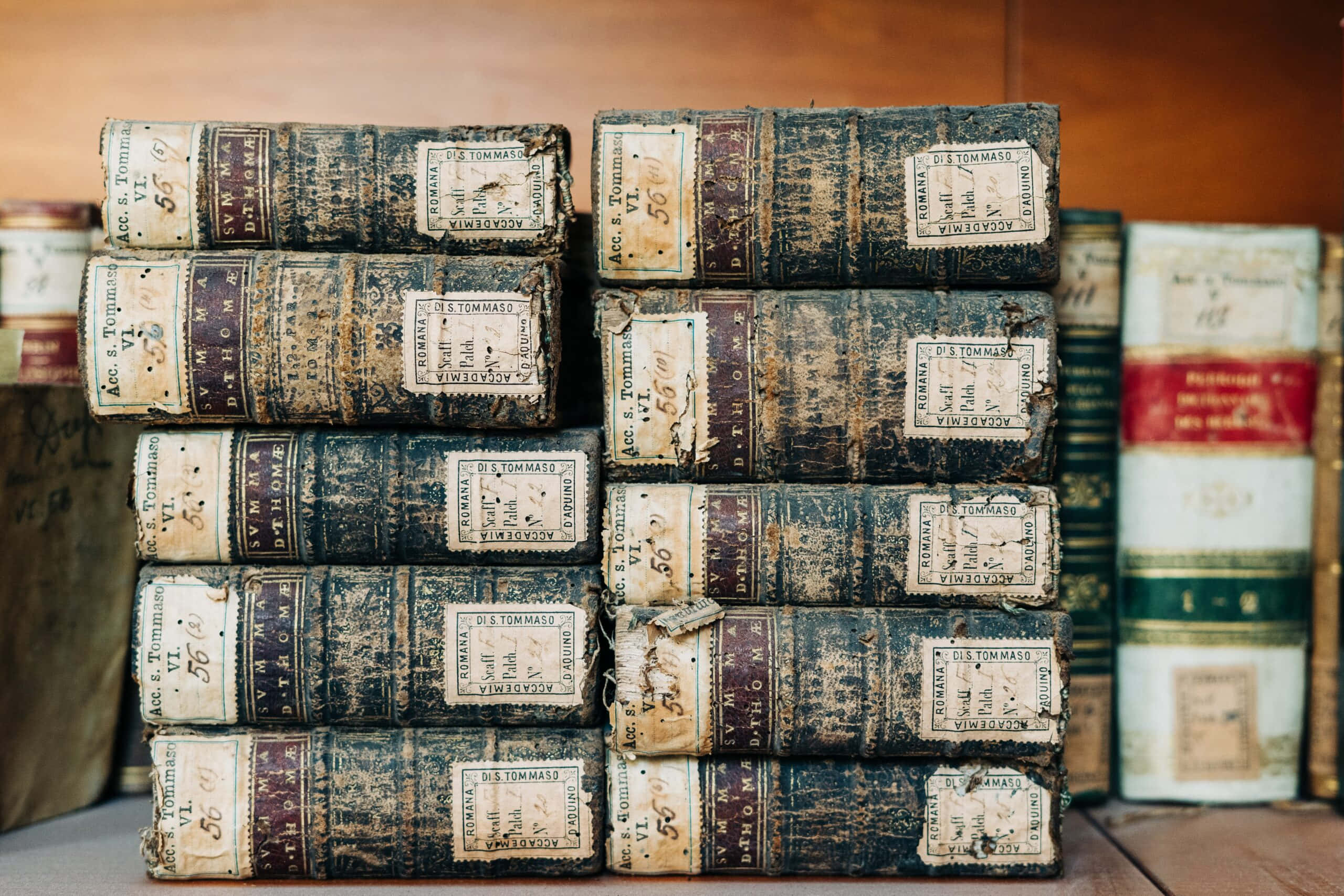 antique books collection, aged leather-bound books, faded labels, 2K Desktop Wallpaper