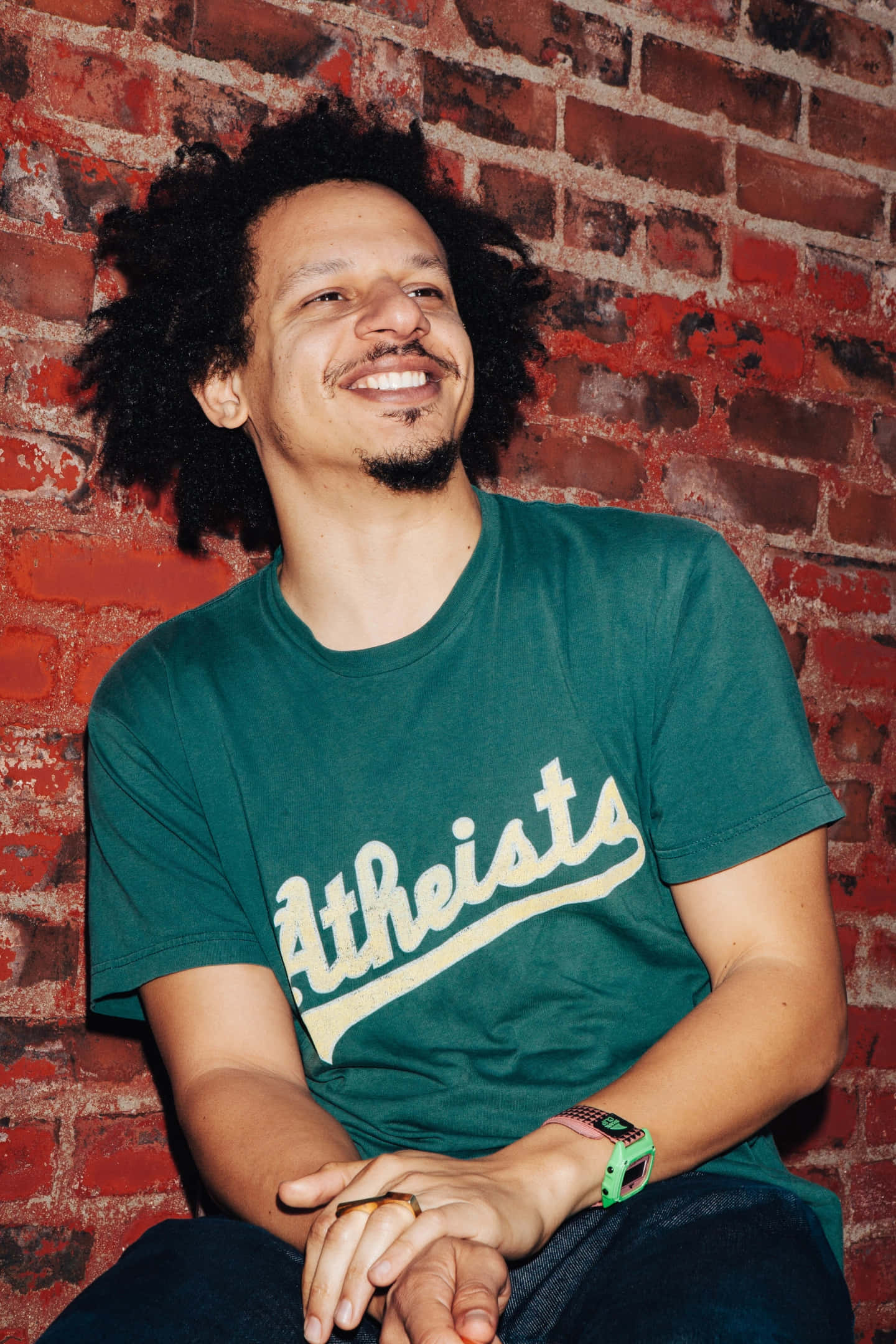 Eric Andre, red brick wall, green t-shirt, Full HD Phone Wallpaper