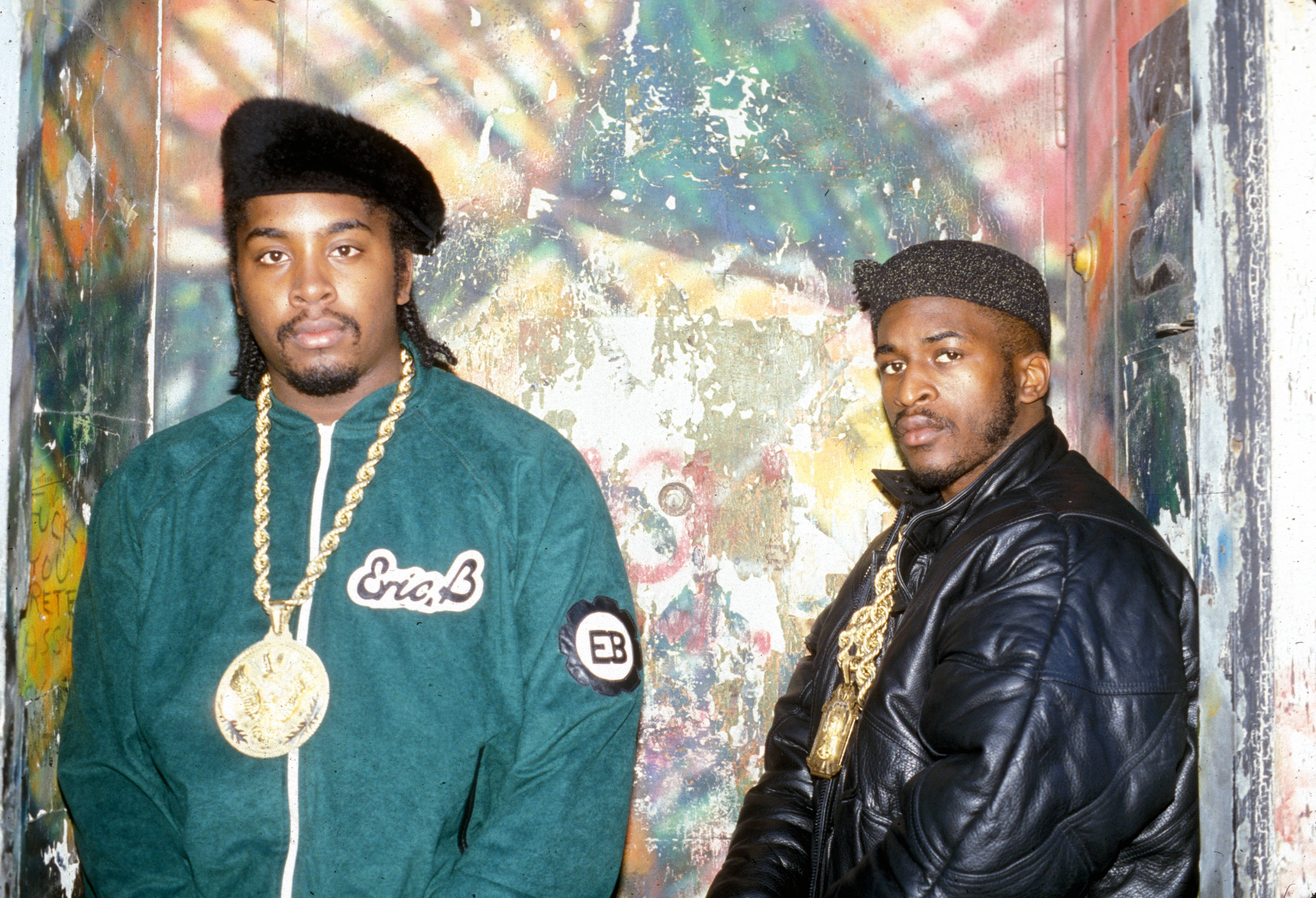 Eric B And Rakim, 90s streetwear, vibrant graffiti-covered wall, 2K Desktop Wallpaper