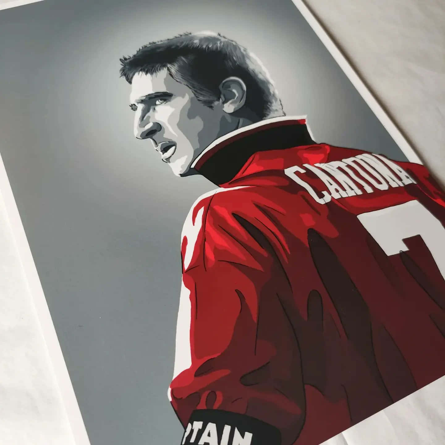 Eric Cantona, red captain's jersey, gray background, HD Desktop Wallpaper