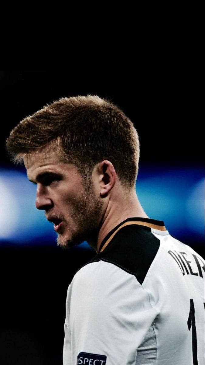 Eric Dier, white jersey, dark blurred stadium background, SD Phone Wallpaper