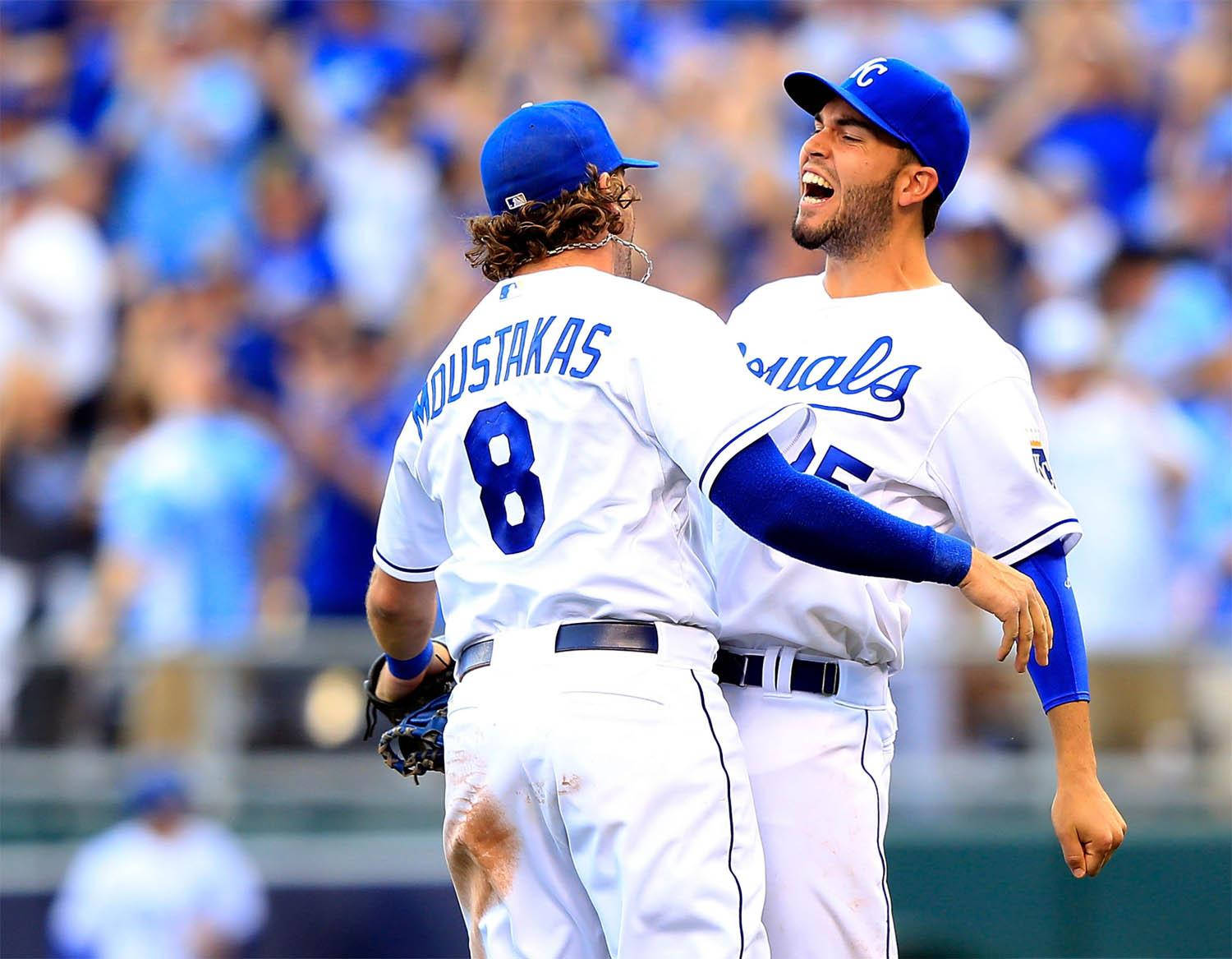 Eric Hosmer, bumping his teammate, white and blue uniforms, HD Desktop Wallpaper