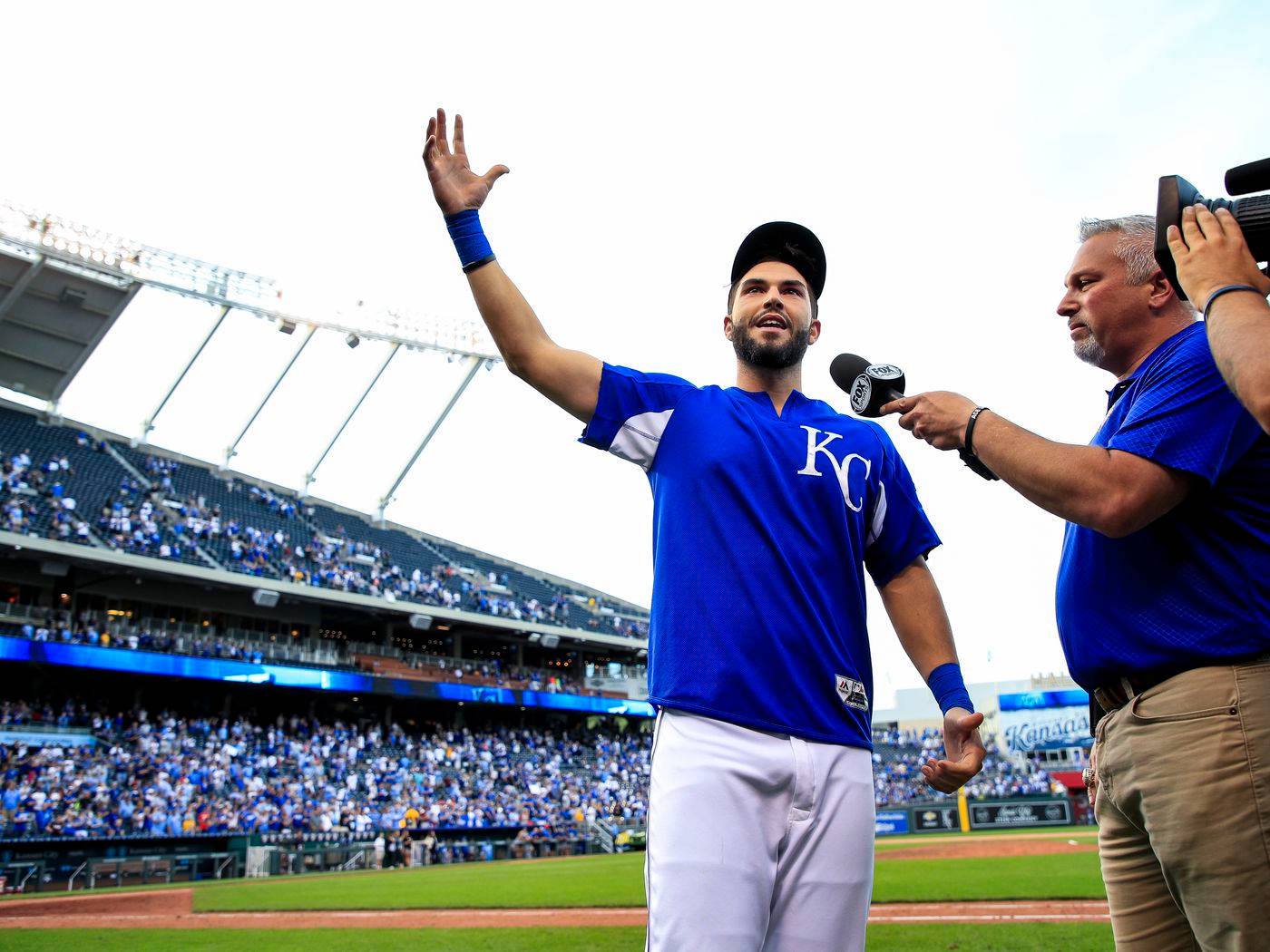 Eric Hosmer, blue KC jersey, sunlit stadium field, HD Desktop Wallpaper
