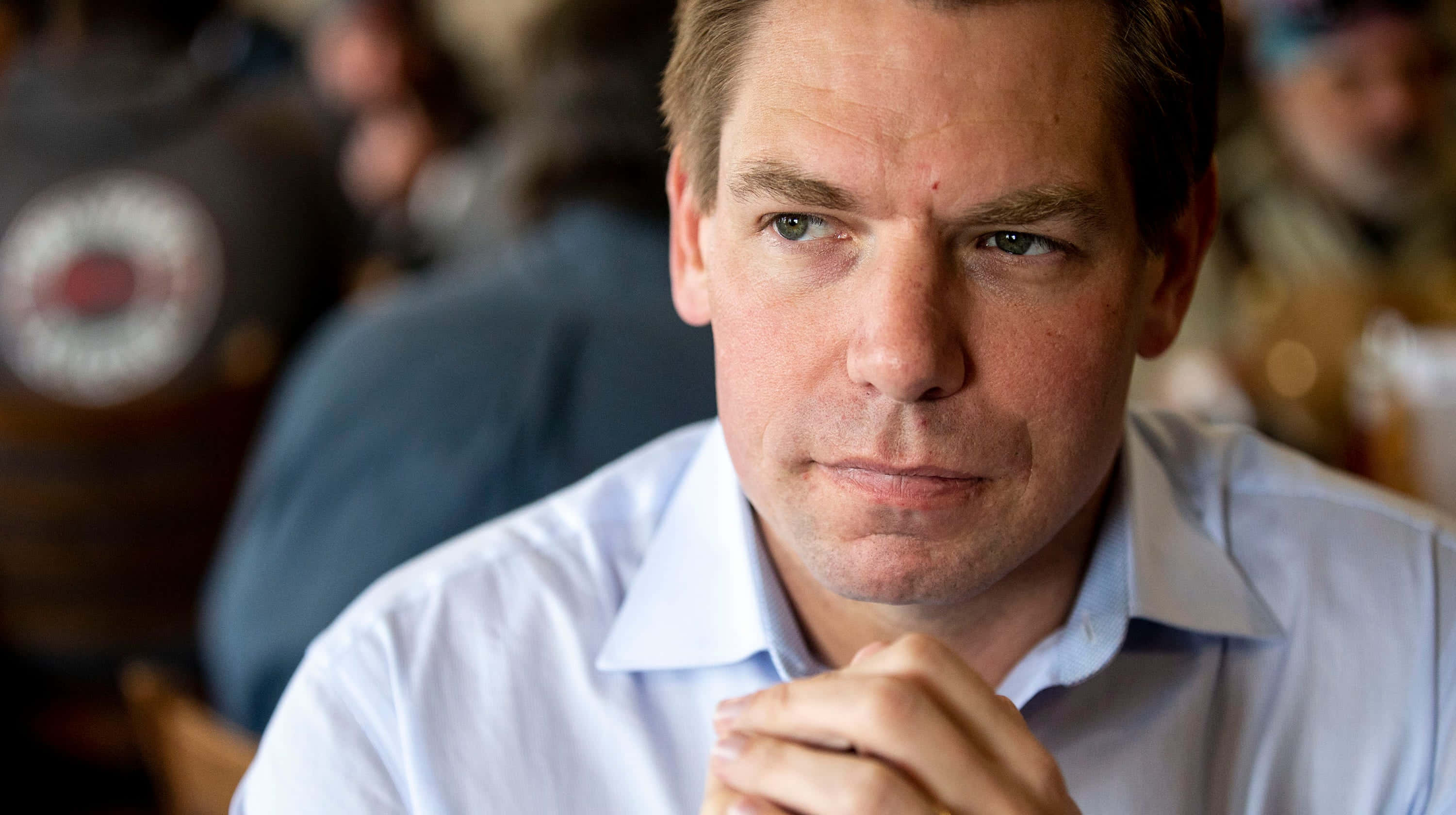 Eric Swalwell, light blue shirt, clasped hands, 2K Desktop Wallpaper