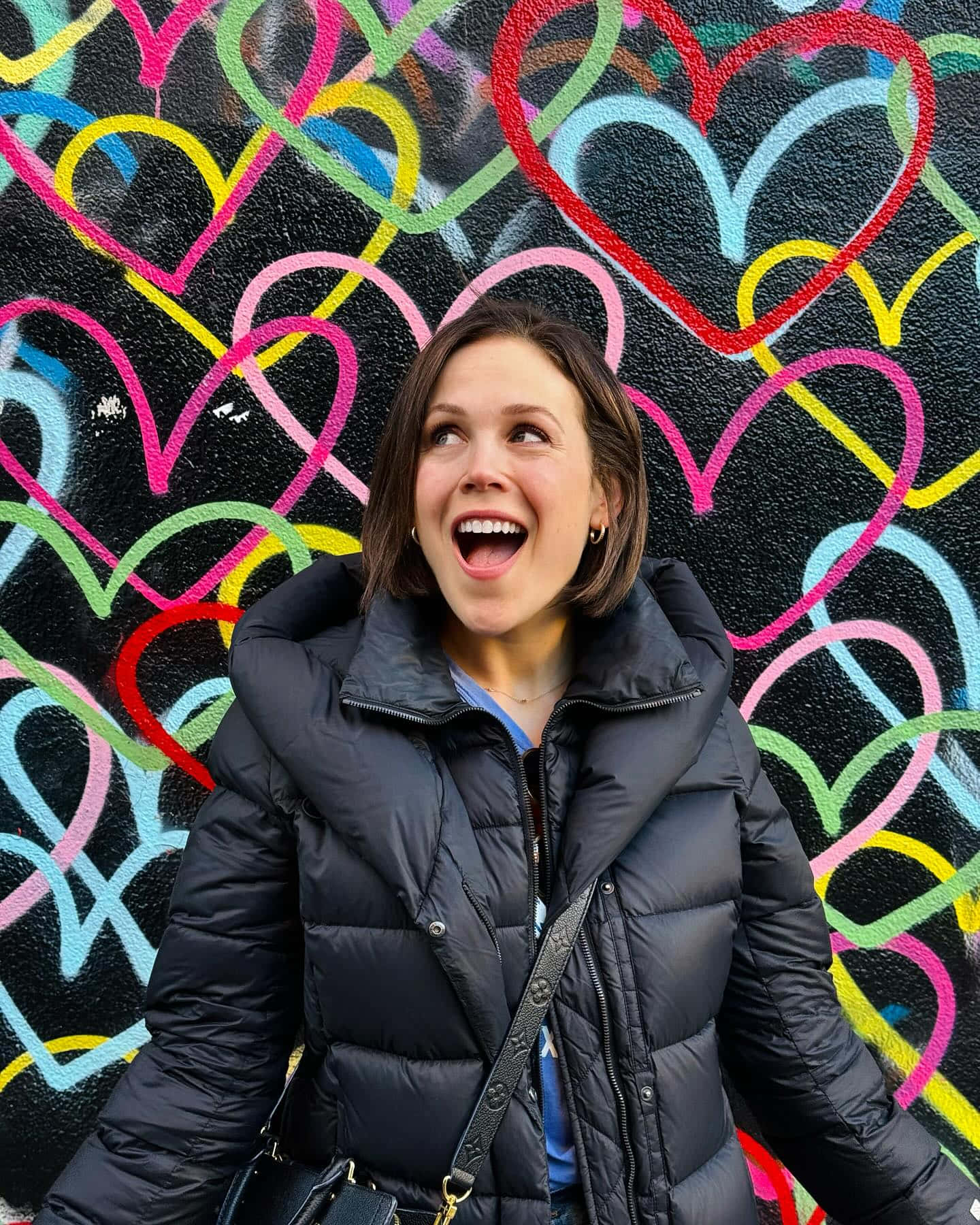 Erin Krakow, black puffer jacket, vibrant graffiti wall, HD Phone Wallpaper