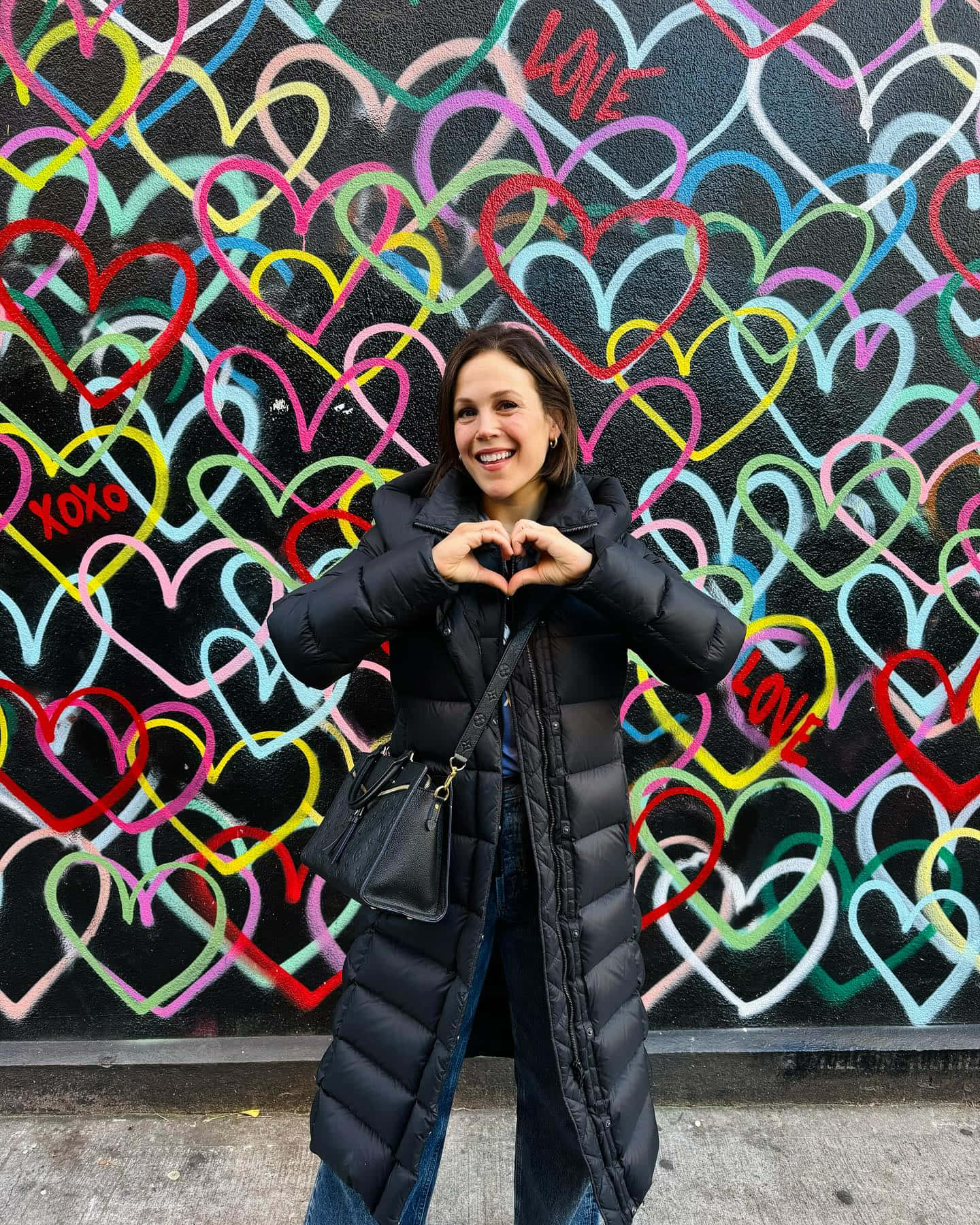 Erin Krakow, heart hand gesture, black puffer coat, HD Phone Wallpaper
