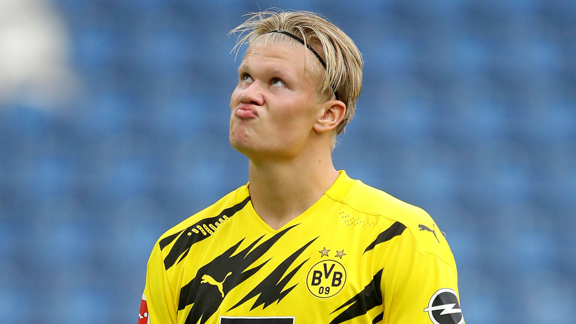 Erling Haaland, yellow BVB jersey, blurred blue stadium background, Full HD Desktop Wallpaper
