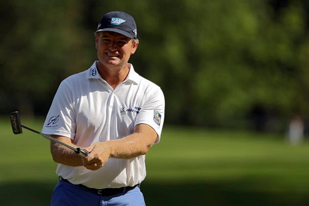 Ernie Els, putter, sunlit green golf course, SD Desktop Wallpaper