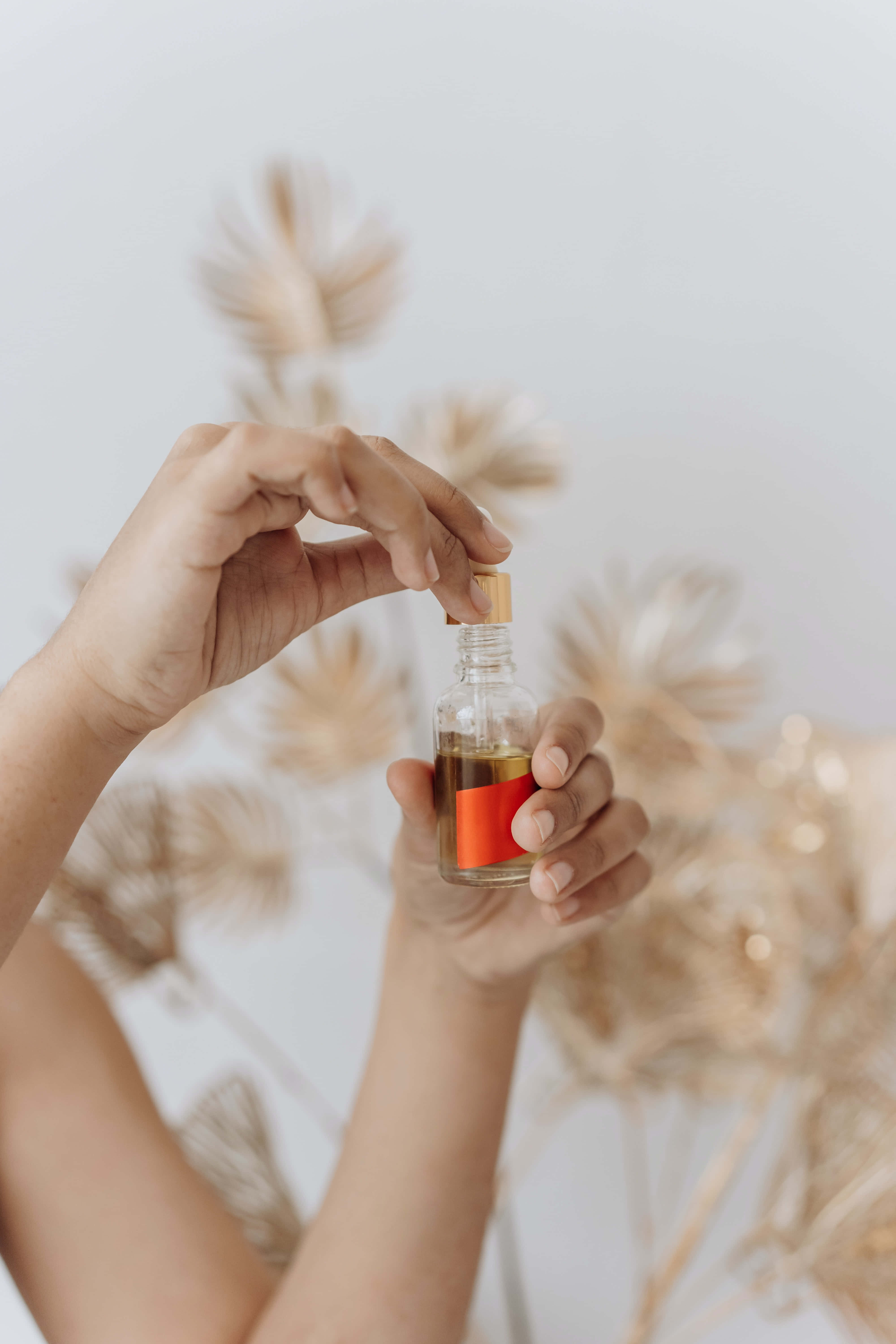 antiseptic essential oil, glass bottle, amber liquid, 5K Phone Wallpaper