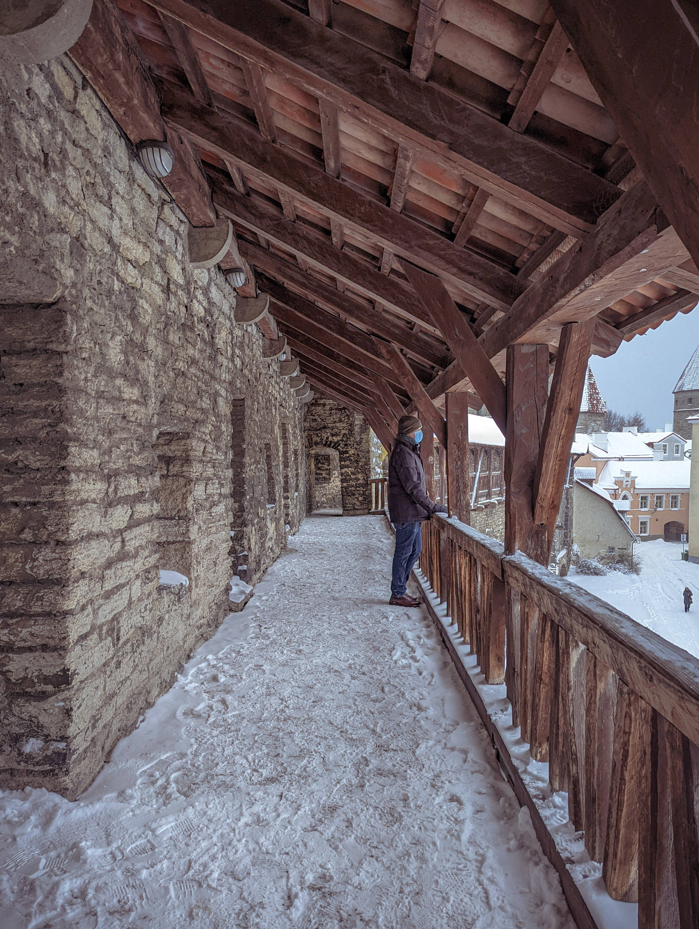 Estonia, ancient wooden castle, snow-covered wooden walkway, 2K Phone Wallpaper